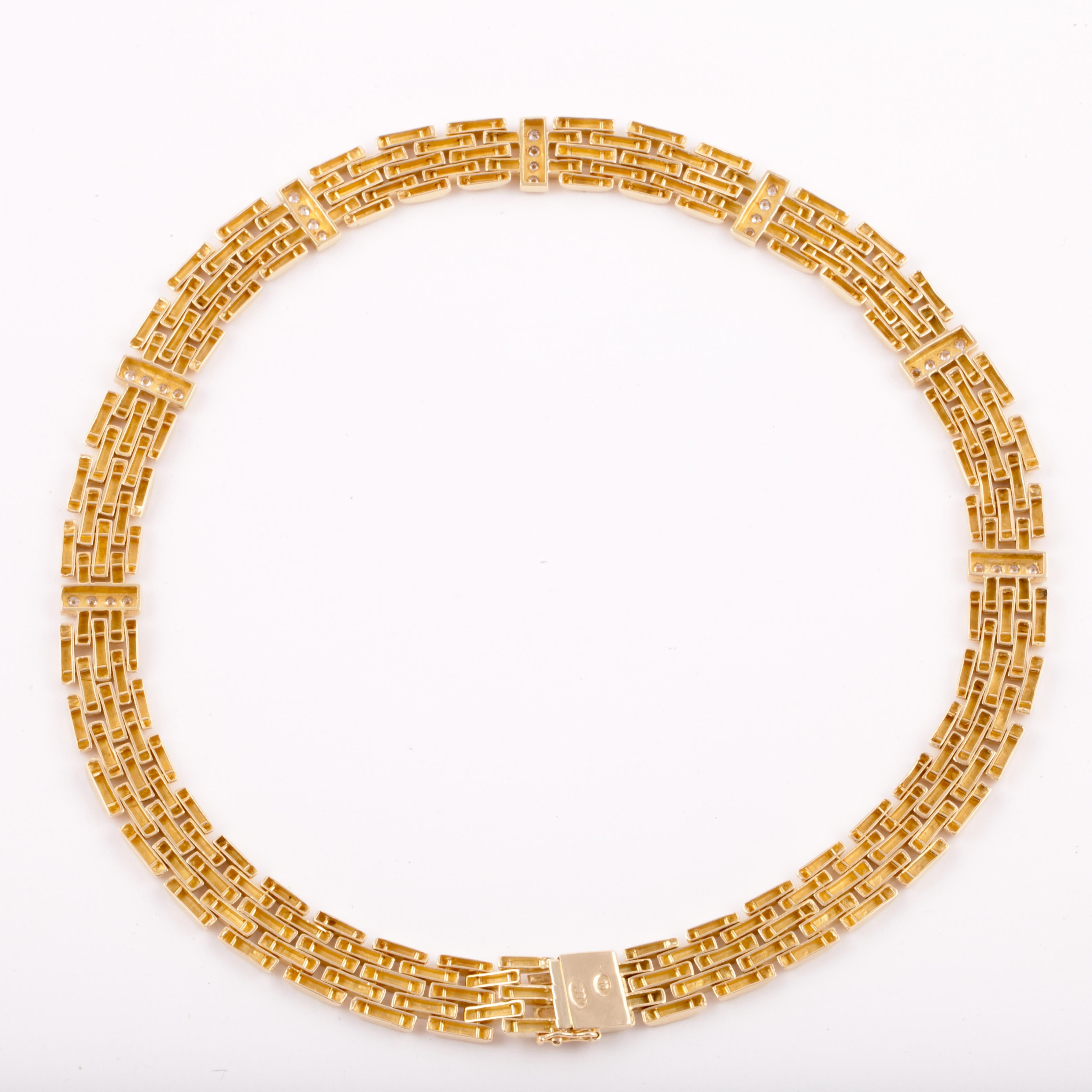 18K yellow gold panther link style necklace with diamonds.  The round diamonds total 1.10 carats,  H-I color and VS clarity.  Measures 16 inches long and 7/16 inches wide.  