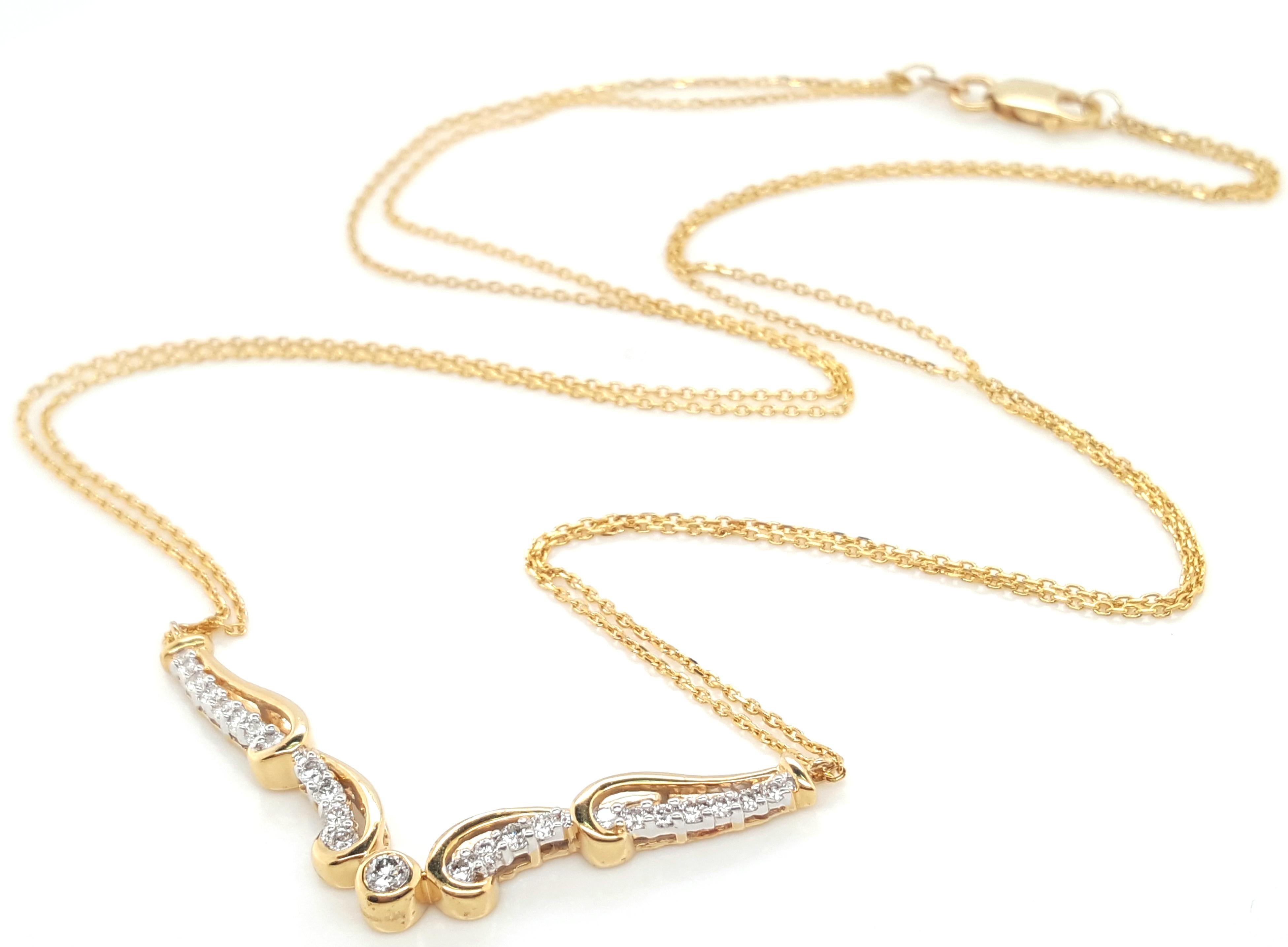  18 Karat Yellow Gold Diamond Necklace with Double Chain  The classically stunning necklace features  a V-shaped line of diamonds suspended by two delicate 18 karat yellow gold link chains with a lobster claw clasp. There are 23 full cut round