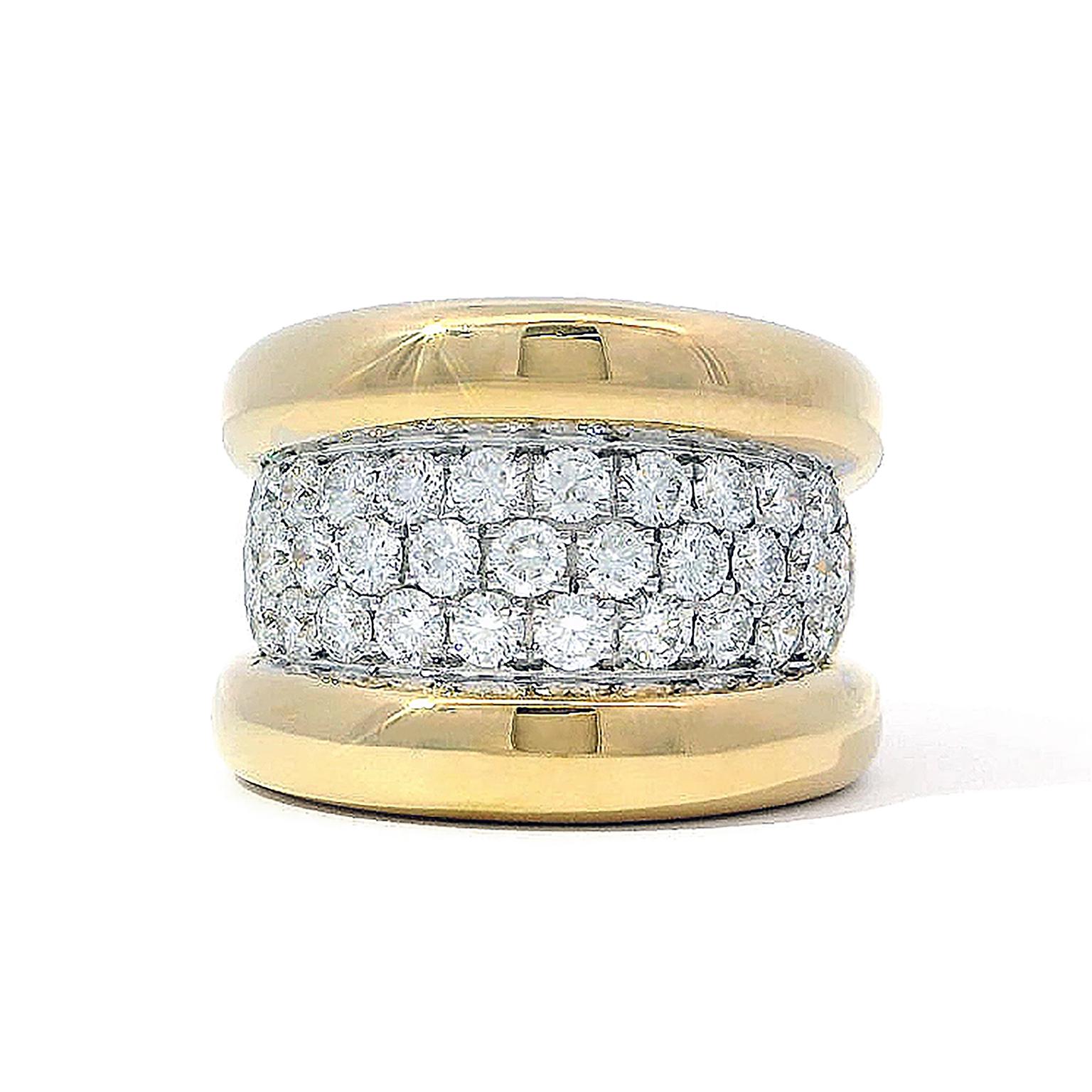 Brightness adorns this ring. Its edges are raised 18k yellow gold polished to mirror-like shine. Between the precious metal is a swath of pavé set round brilliant-cut diamonds. The 31 jewels weigh a combined 1.86 carats. 