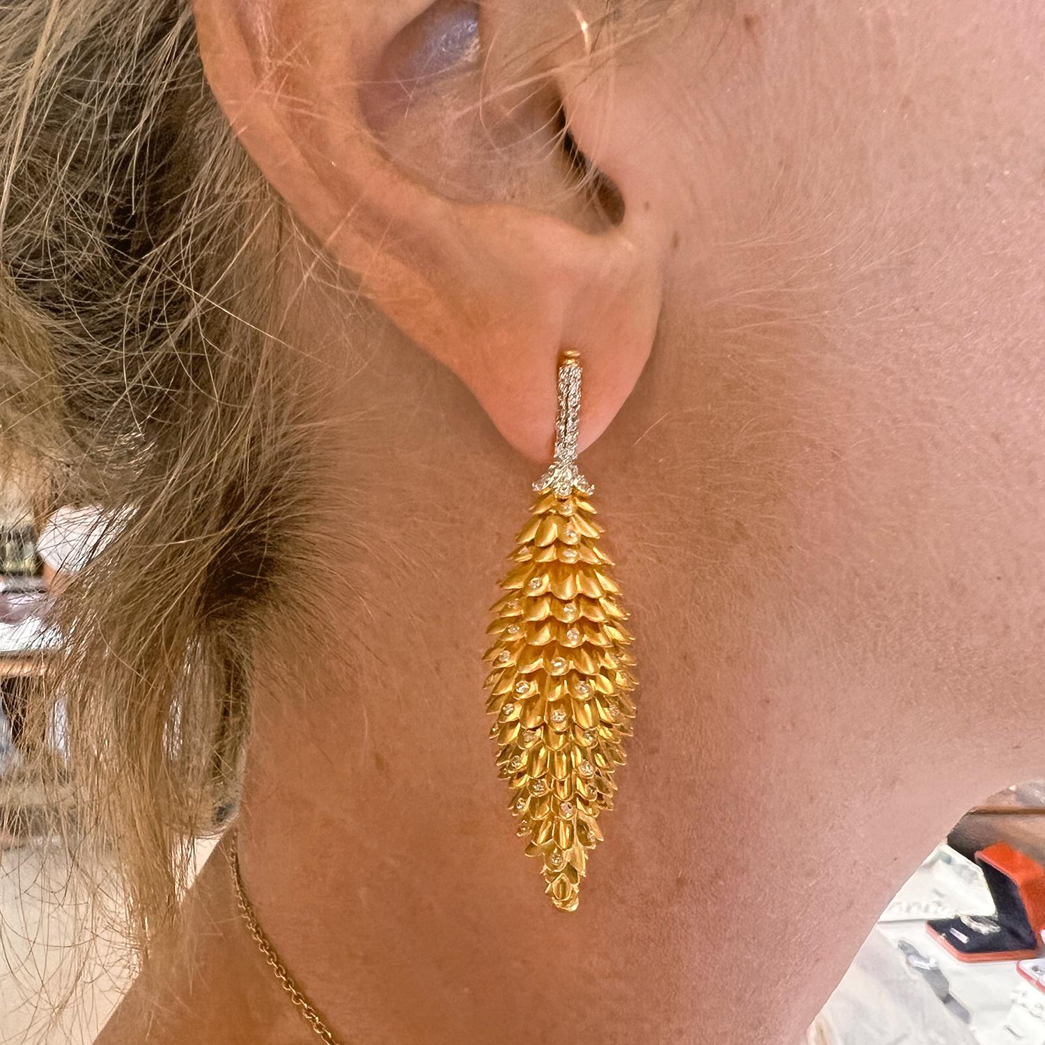 Pinecone-style articulated drop earrings, the scales of the cone designed in textured 18k yellow gold accented by small round-cut diamonds, with a pave-set diamond surmount in 18k white gold.  Diamonds weighing 1.60 total carats.  Posts with