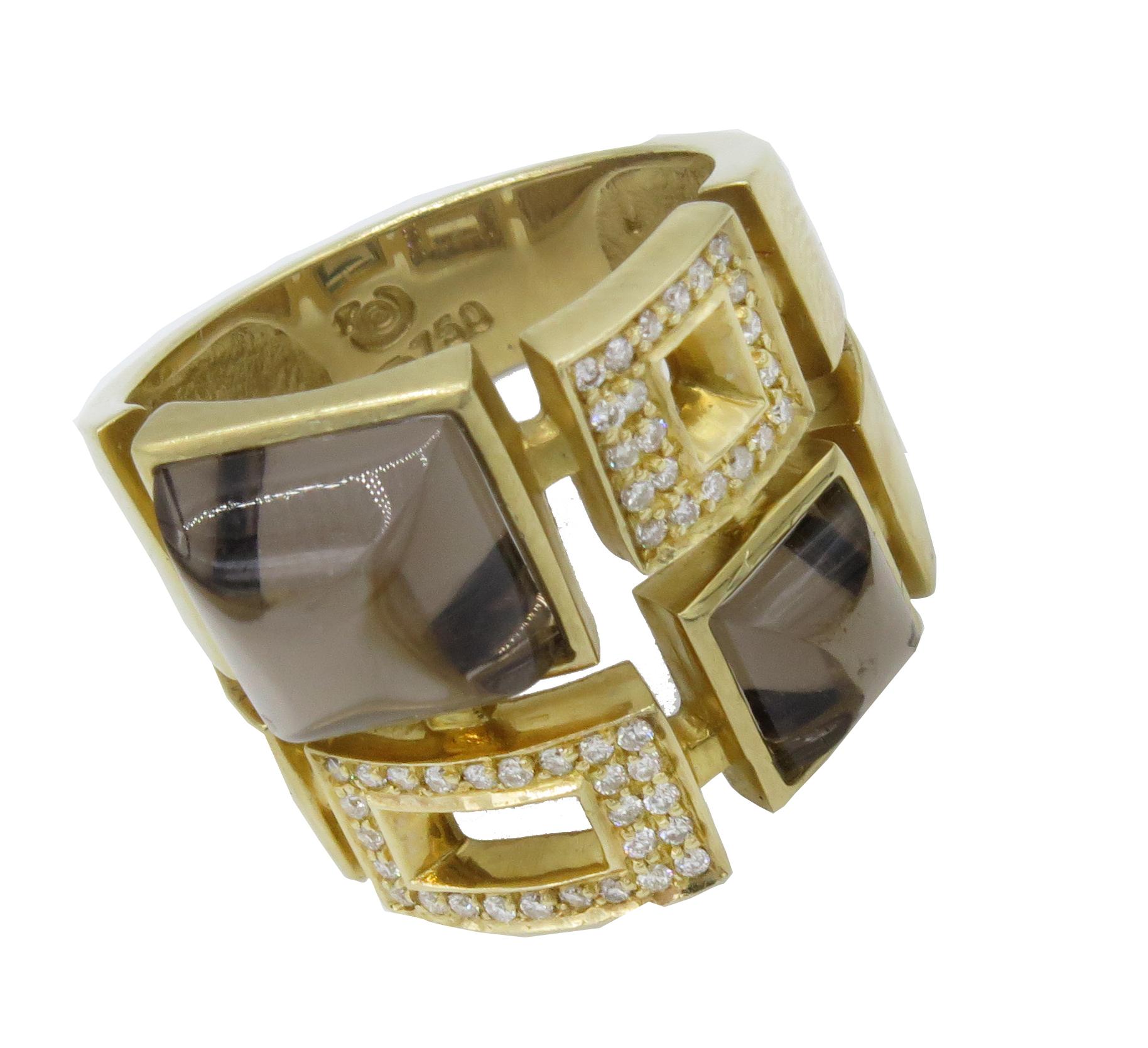 A uniquely designed 18kt yellow gold ring of semi-precious and precious gemstones. In, a 18kt yellow gold in a u.s ring size 6.5.  A, beautiful design with a two different size topaz and pave set diamonds. The ring weighs 10.26 grams. Stamped 