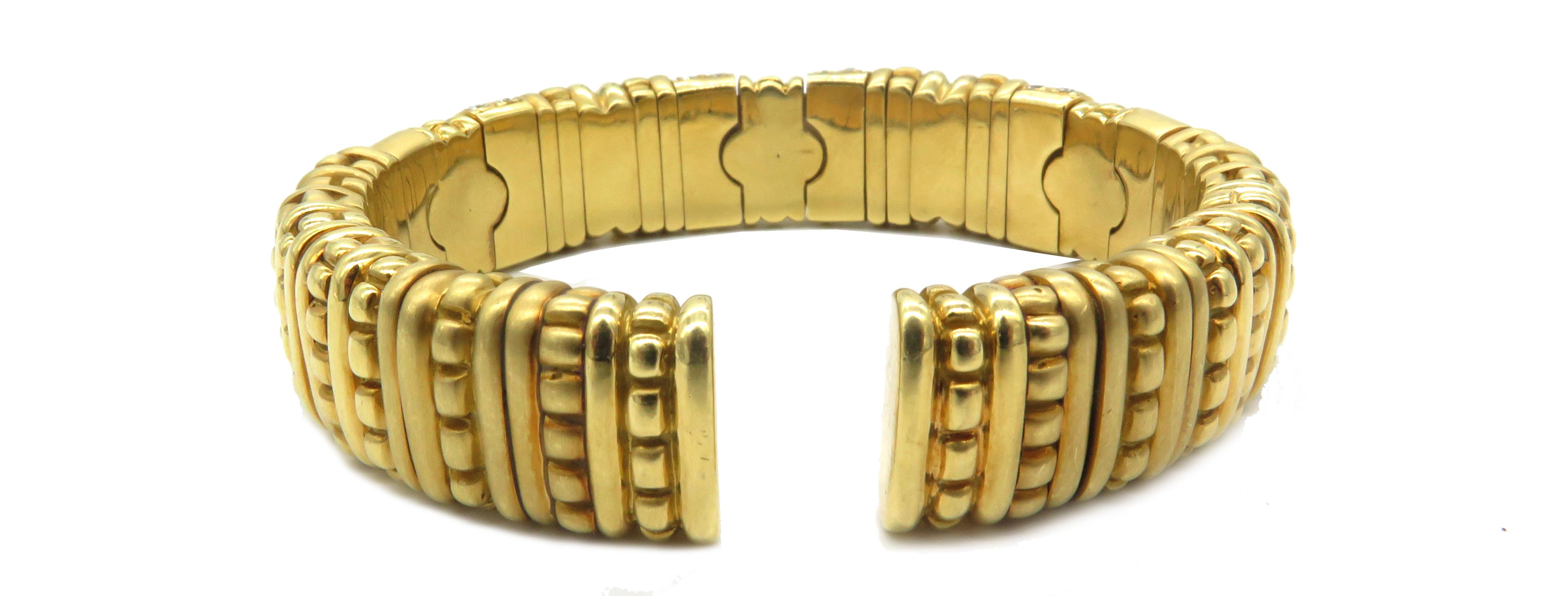 18K Yellow Gold
Dia 2.50cts
An 18 Yellow Gold bangle with an array of diamonds. This beautiful bangle also has a 3 rubelite following the pattern of the decorative design in the bangle. There, an approximate 2.50cts in diamonds. The bangle weighs