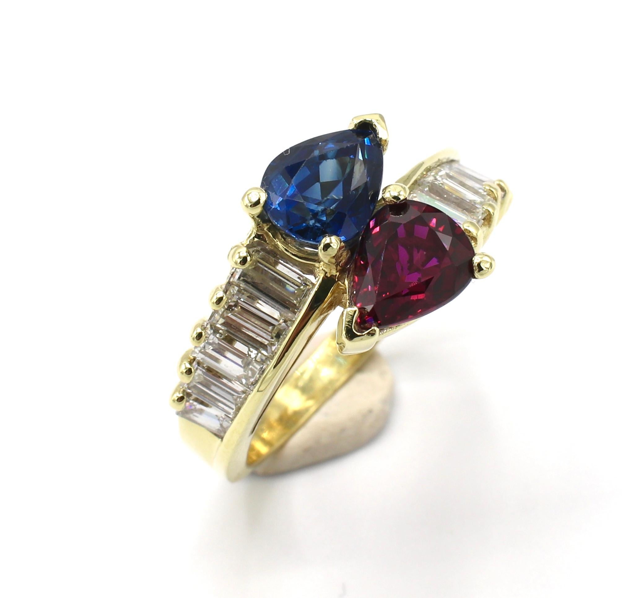GIA Certified 18K Yellow Gold Diamond, Ruby & Blue Sapphire Bypass Ring Size 8 
GIA Report Numbers: 2215407435 & 2215407422 (please note original reports pictured for details)
Metal: 18k yellow gold
Weight: 7.20 grams
Ruby: 1.54 Carats 
Blue