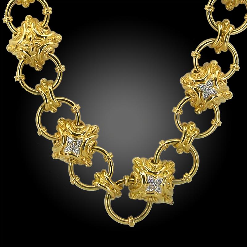 Doorknocker Diamond Link Convertible Necklace Belt in 18k Yellow and White Gold.

A bold and weighty link belt dating from the 1980s, worn as a necklace or belt around the waist. Doorknocker style motifs cast in yellow gold are embellished with