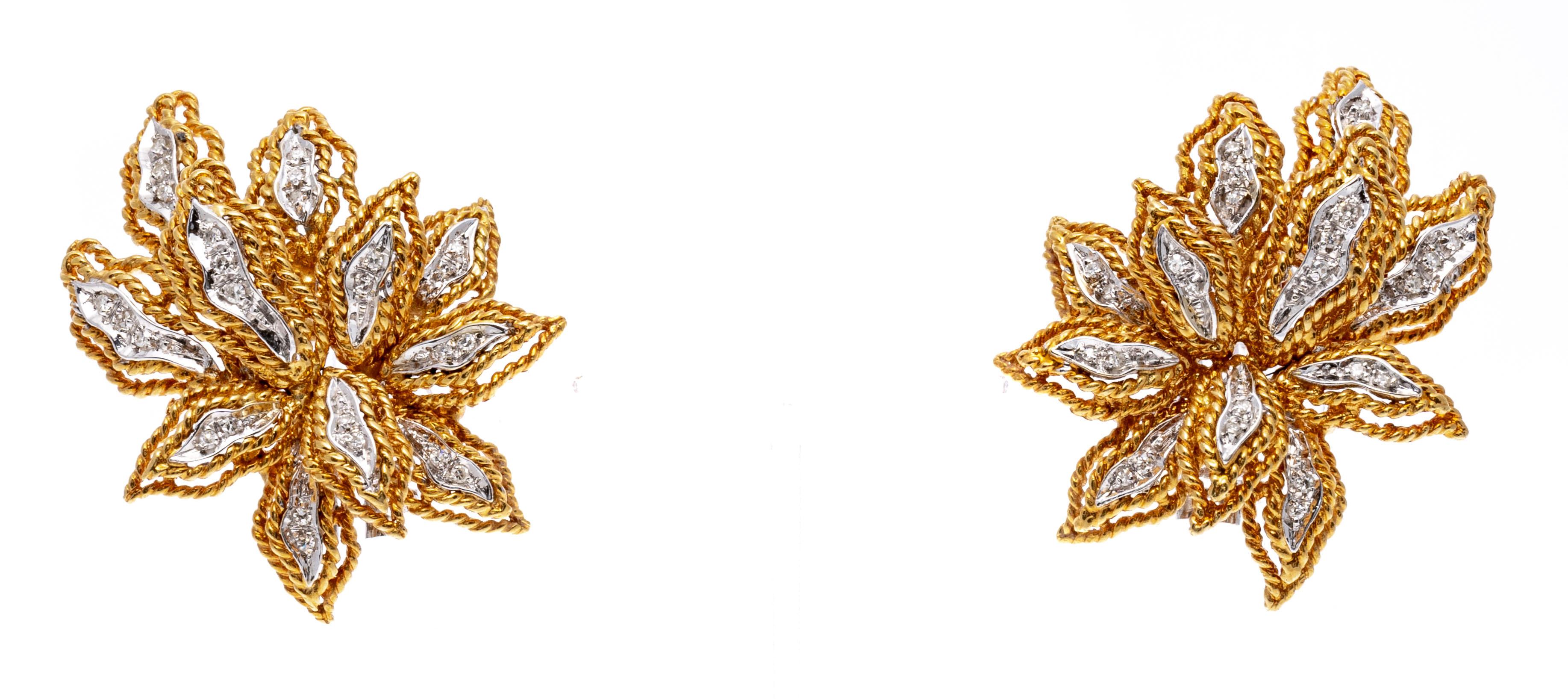 18k Yellow Gold Glamorous Diamond Set Leaf Motif Earrings, App. 0.13 TCW
These glamorous earrings are a leaf cluster motif, decorated with round faceted diamonds, approximately 0.13 TCW, and trimed with a double rope edge. The earrings have no