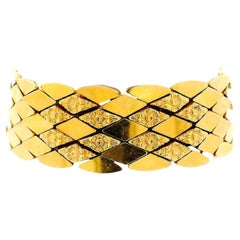 Bracelet italien en or jaune 18K à maillons en forme de diamant avec quatre motifs floraux