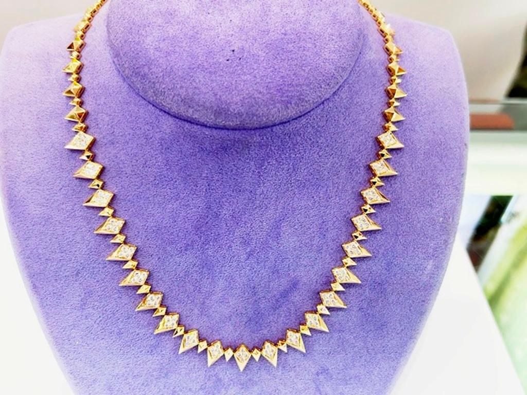 18KYG Diamond Spike Design Necklace 3.07CTS

Strong spiked shapes make each of these diamonds sparkle. A necklace of modern elegance that will draw attention of everyone in the room! 
 
Diamonds 

84 Round Diamonds= 3.07 Carats 

Color

