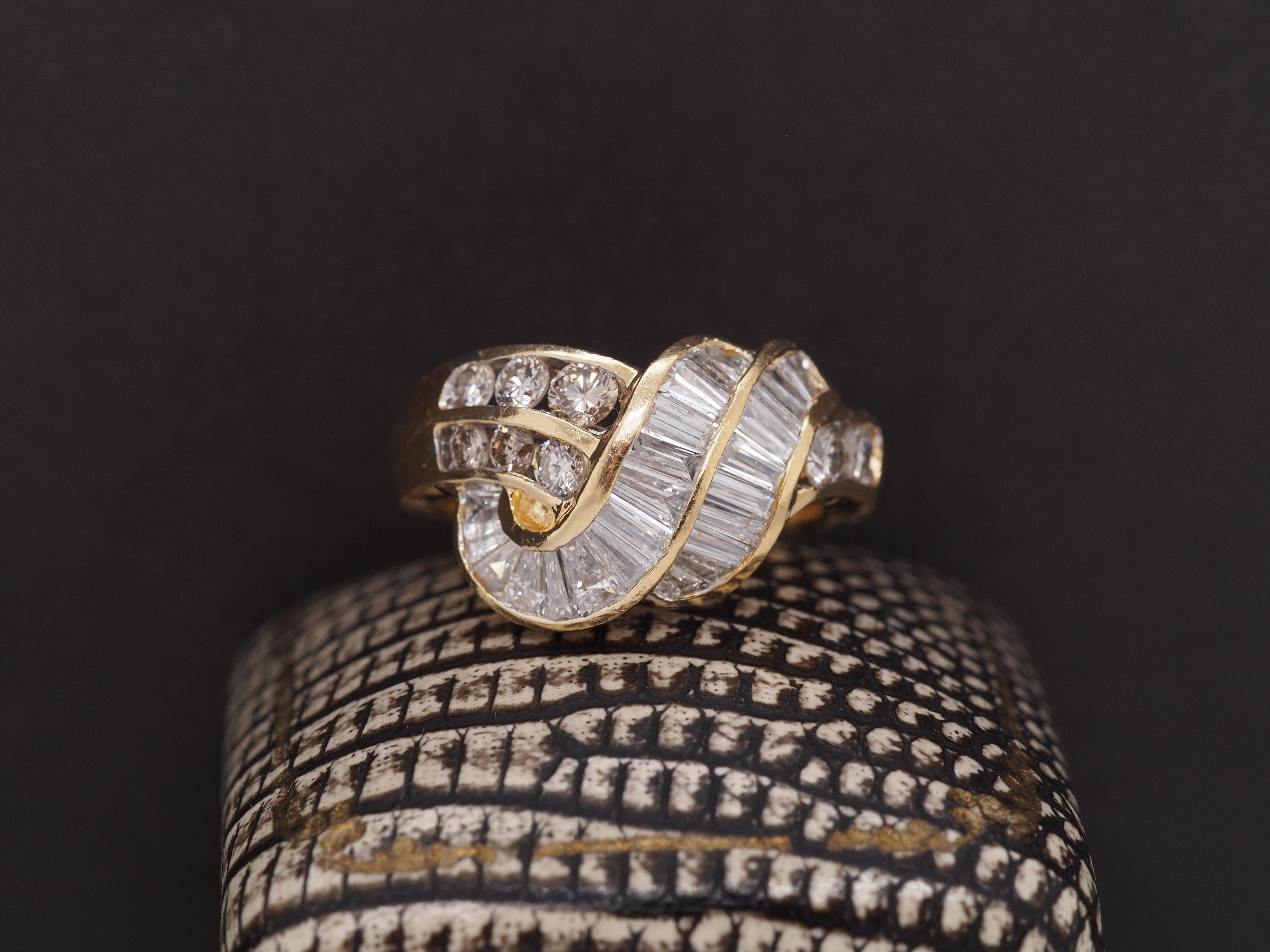 Year: 2000s
Item Details:
Ring Size: 5
Metal Type: 18K Yellow Gold [Hallmarked, and Tested]
Weight: 8.4 grams
Diamond Details: 2.00ct total weight, H/I Color, SI1-I1 Clarity, Round Brilliant and Baguette Shape, Natural Diamonds
Band Width: 3
