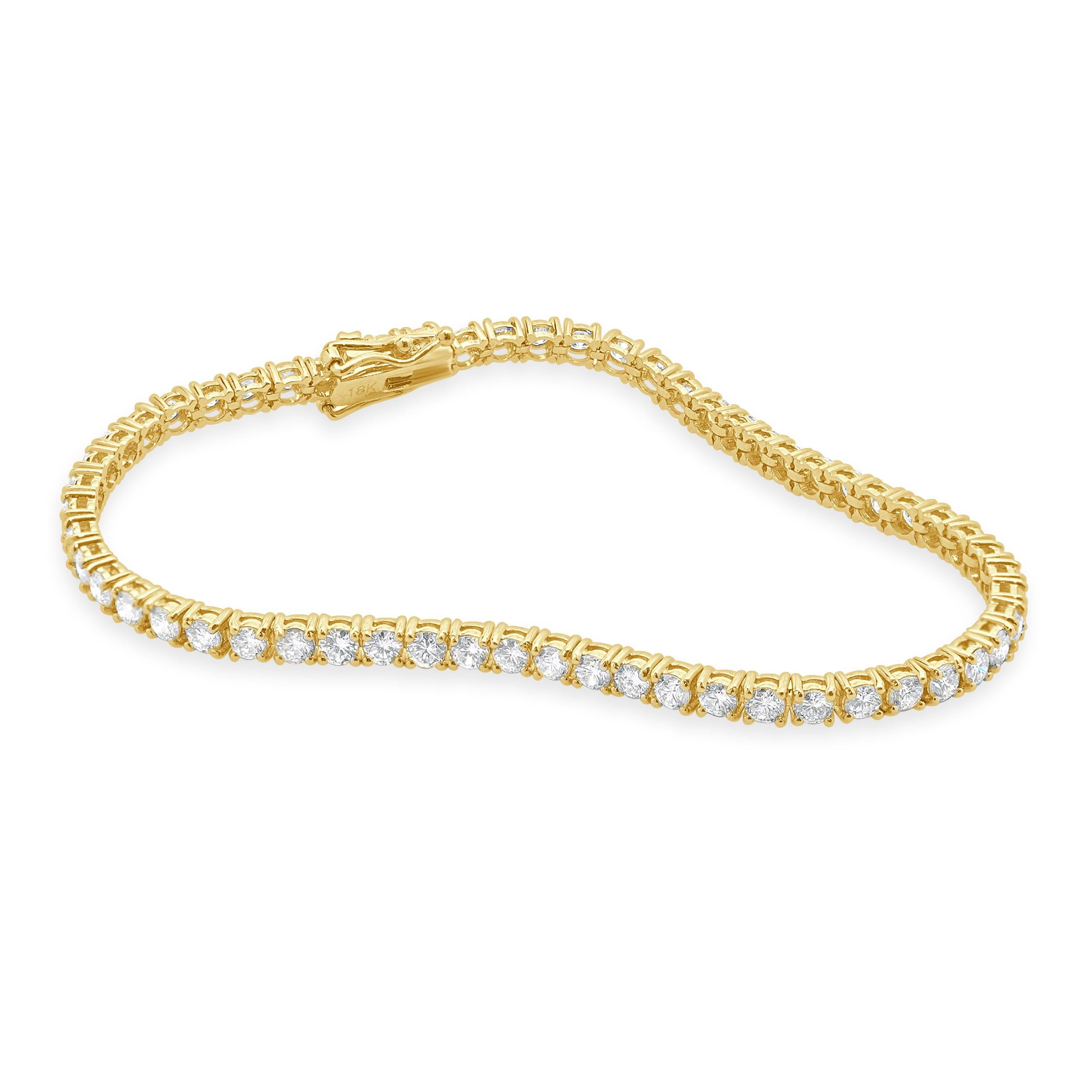 Designer: custom design
Material: 18K yellow Gold
Diamond: 57 round brilliant cut= 4.00cttw
Color: G
Clarity: VS
Dimensions: bracelet will fit up to a 7-inch wrist
Weight: 9.18 grams

