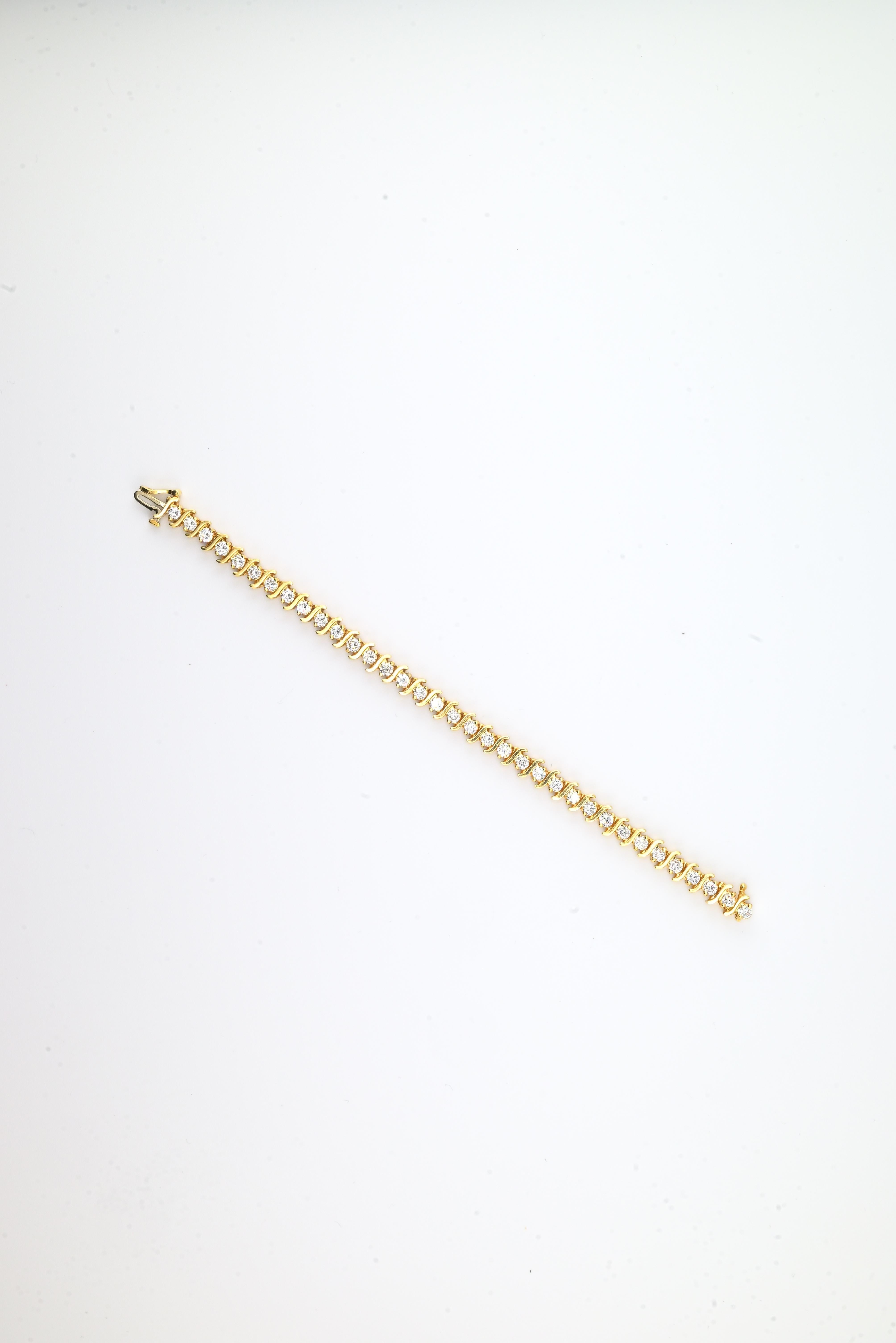 Bracelet de tennis en or jaune 18K avec diamants • 23.31g • 35 diamants naturels en vente 3