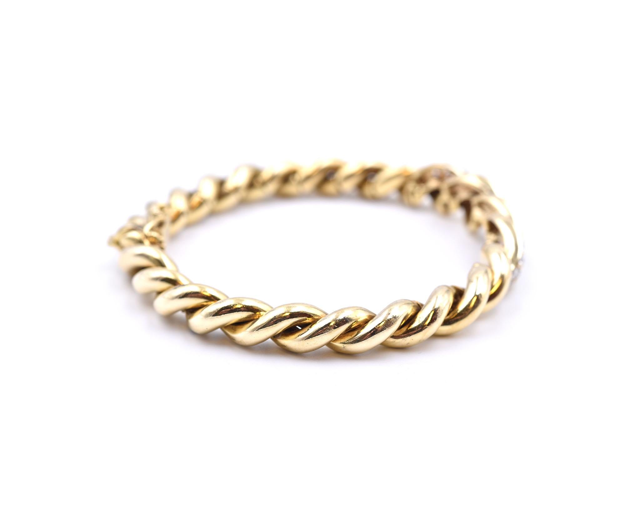 Designer: custom
Material: 18k yellow gold
Diamonds: 56d = 2.25cttw
Color: I
Clarity: SI1
Dimensions: bracelet will fit up to a size 7 wrist and measures 10.45mm in width at its widest point
Weight: 42.44 grams

