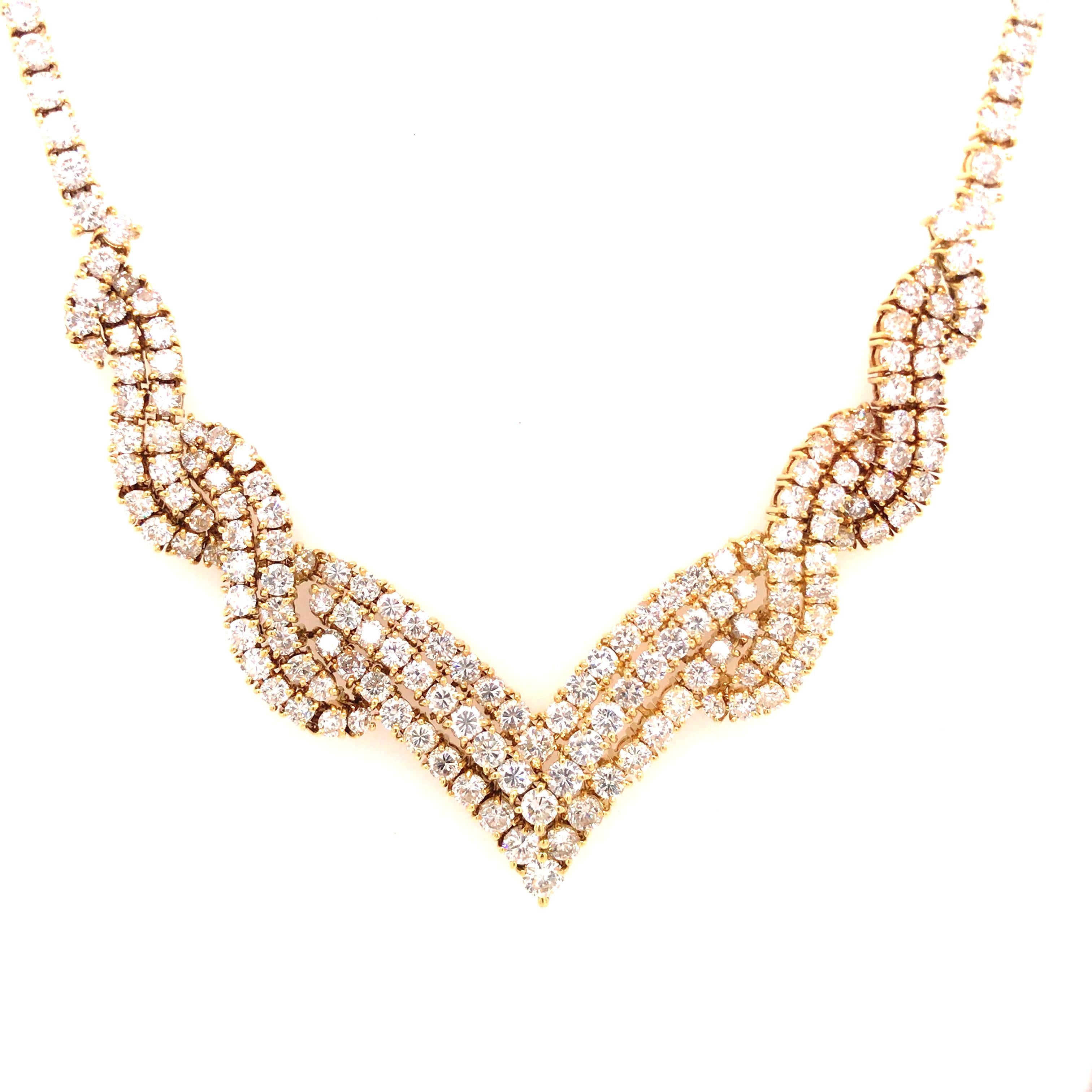 Diamond Weave V Necklace in 18K Yellow Gold.  Round Brilliant Cut Diamonds weighing 23.0 carat total weight, G-H in color and VS-SI in clarity are expertly set.  The Necklace measures 16 1/2 inch in length and 1/2 inch in width at the widest point. 