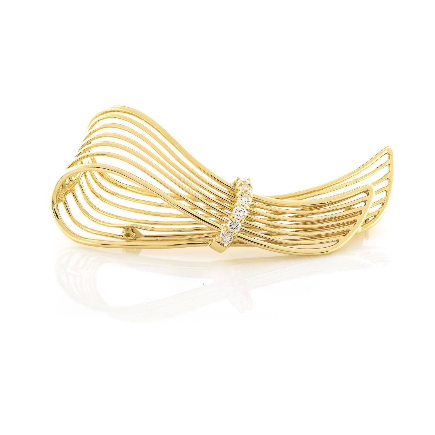 All the elegance and grace tied up in a sparkling ribbon for one special lady! This glamorous pin has six round diamonds 0.42ctw (G Color and VS Clarity) and is crafted in 18K yellow gold in a wire structure overlapping one end over the other. This