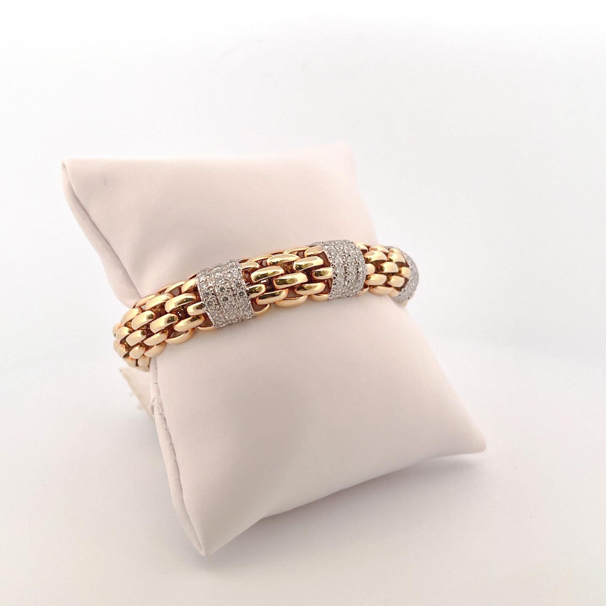 From the Eiseman Estate Jewelry Collection, 18 karat yellow gold diamond woven link cuff bracelet. This bracelet is crafted with 108 pave diamonds with a combined total weight of 2.00 carats. These diamonds are set in rows of 3 along 3 stations. 