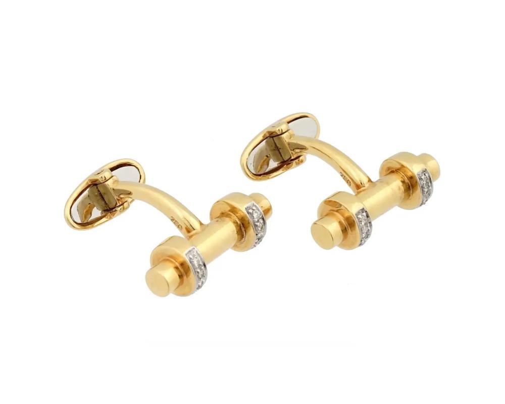 An 18K Yellow Gold cuff links made in the Edwardian manner. The cufflinks are made in a shape of cylinder with a pair of loops, encrusted with Diamonds. Each is marked with a 750 Gold hallmark. Weight 11.25 grams. Vintage and Modern Mens Jewelry