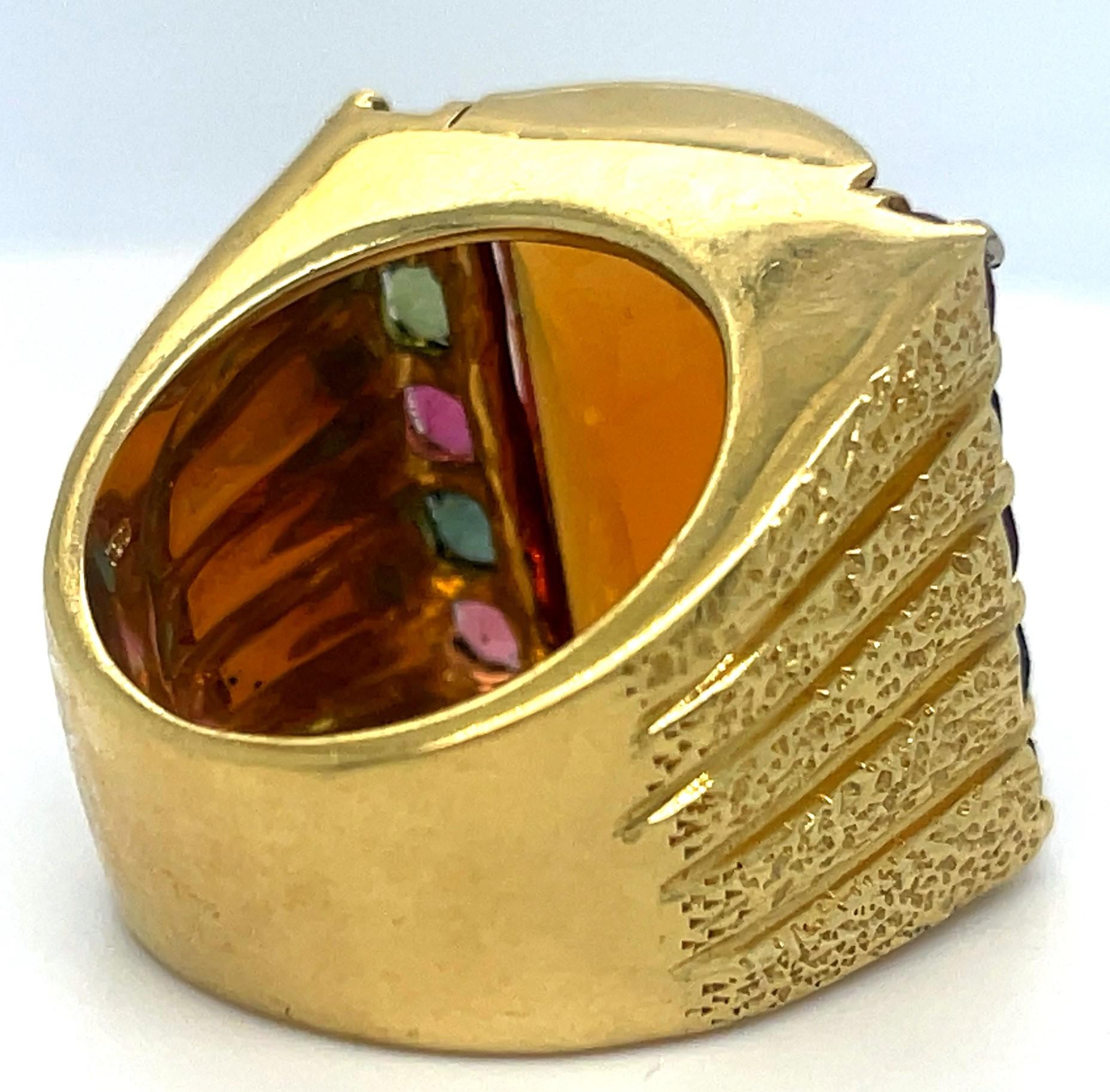 Gorgeous, Heavy Ring with Uniquely Shaped Citrine (Sort of a domed faceted rectangle)
Includes Appx 3 cts of alternating color tourmaline
Dimensions of Plaque = 24 mm Wide x 23 mm Long
Size 8.75
Width of Band at Back = 10 mm
Total Mass = 31.3