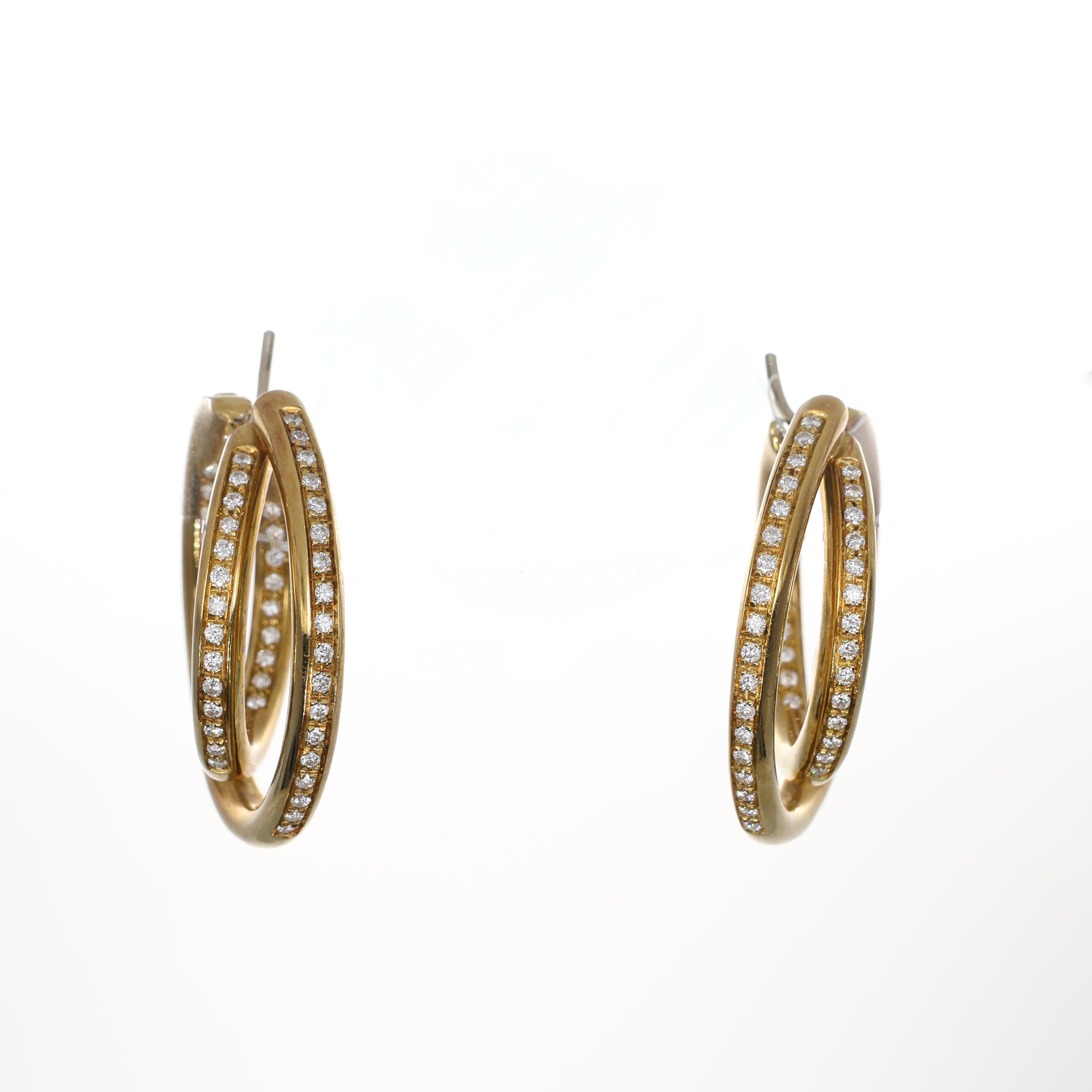 Elegant and contemporary, these 18K yellow gold hoop earrings feature an innovative double-circle design, creating a dynamic sense of movement and sophistication. Each hoop is adorned with a refined pavé of brilliant-cut diamonds, enhancing their