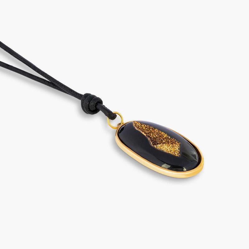 18k Yellow Gold Drusy Agate Pendant

A midnight black drusy with a gold centre is placed within a shiny gold setting, allowing the raw and organic beauty of the stone to be admired from nearly all angles. The case is set in 18k yellow gold,