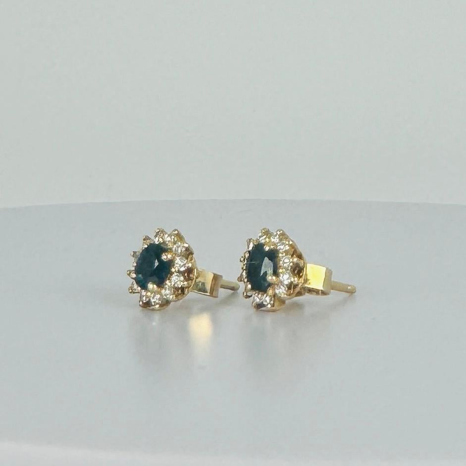 18k yellow gold earrings with 12 brilliant cut diamonds and oval blue sapphire In Good Condition For Sale In Heemstede, NL