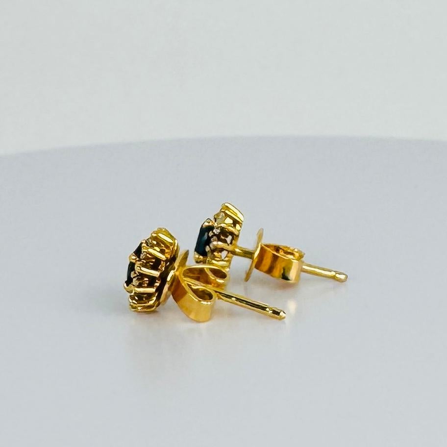 Women's 18k yellow gold earrings with 12 brilliant cut diamonds and oval blue sapphire For Sale
