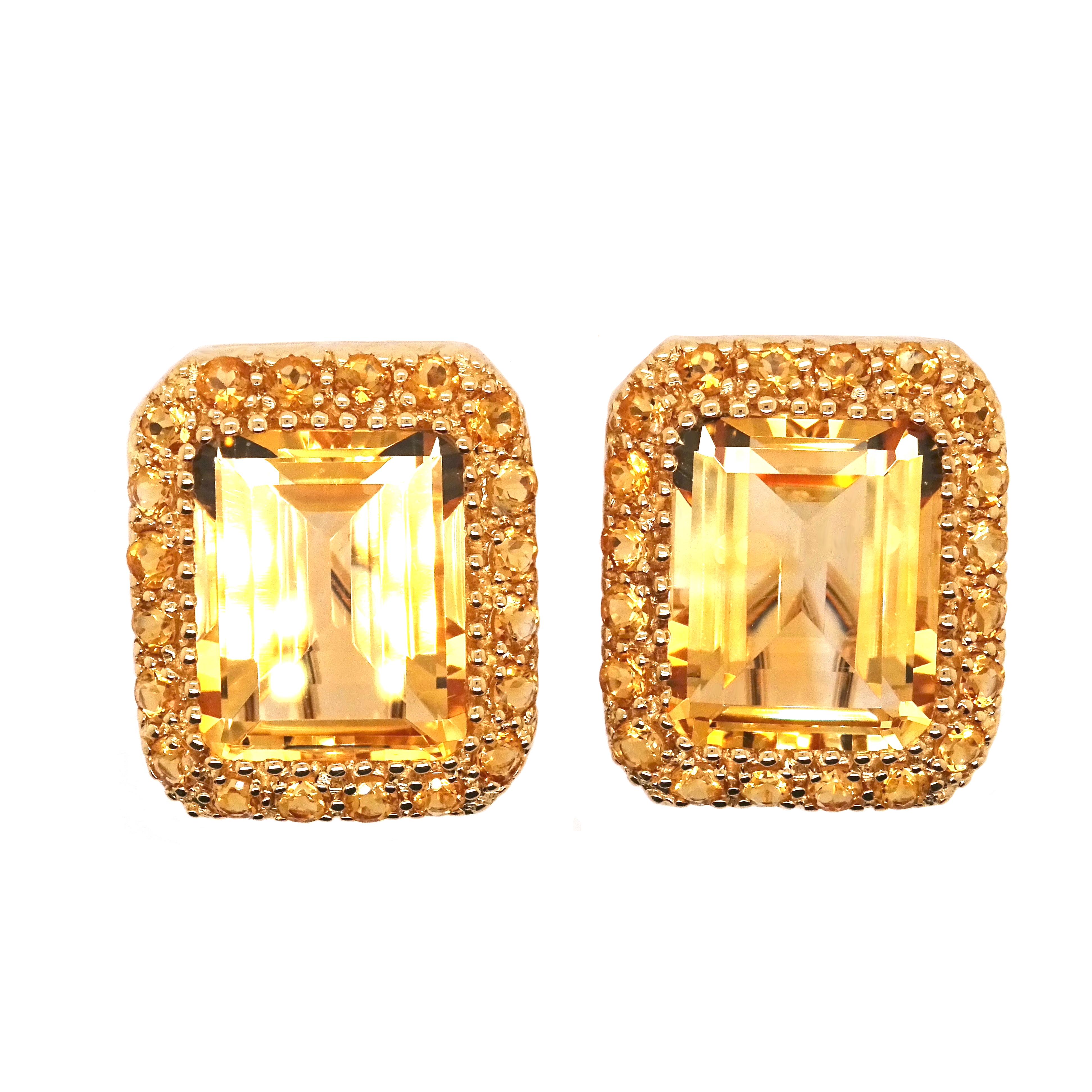 Step into the realm of luxury with our breathtaking 18K yellow gold earrings, featuring a dazzling combination of accent and central citrines in an elegant octagon shape. The sumptuous citrines, with a total carat weight of 24.34, steal the