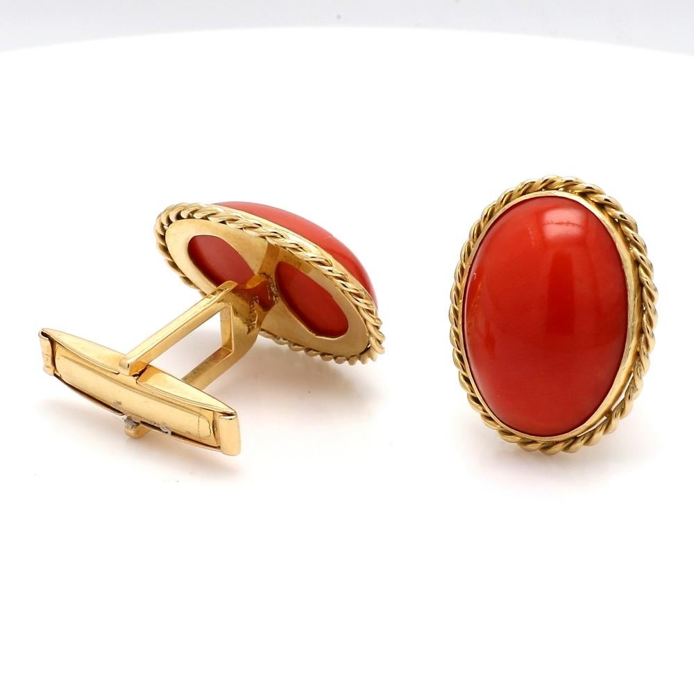 18K Yellow Gold Earrings with Coral

These beautiful 18K yellow gold earrings feature oval-cut coral stones set in twisted wire bezels, offering a unique and vibrant design. Weighing 7.2 grams, they add a bold, natural touch to any jewelry