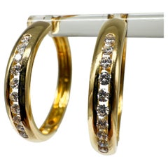 Boucles d'oreilles en or jaune 18K avec diamants