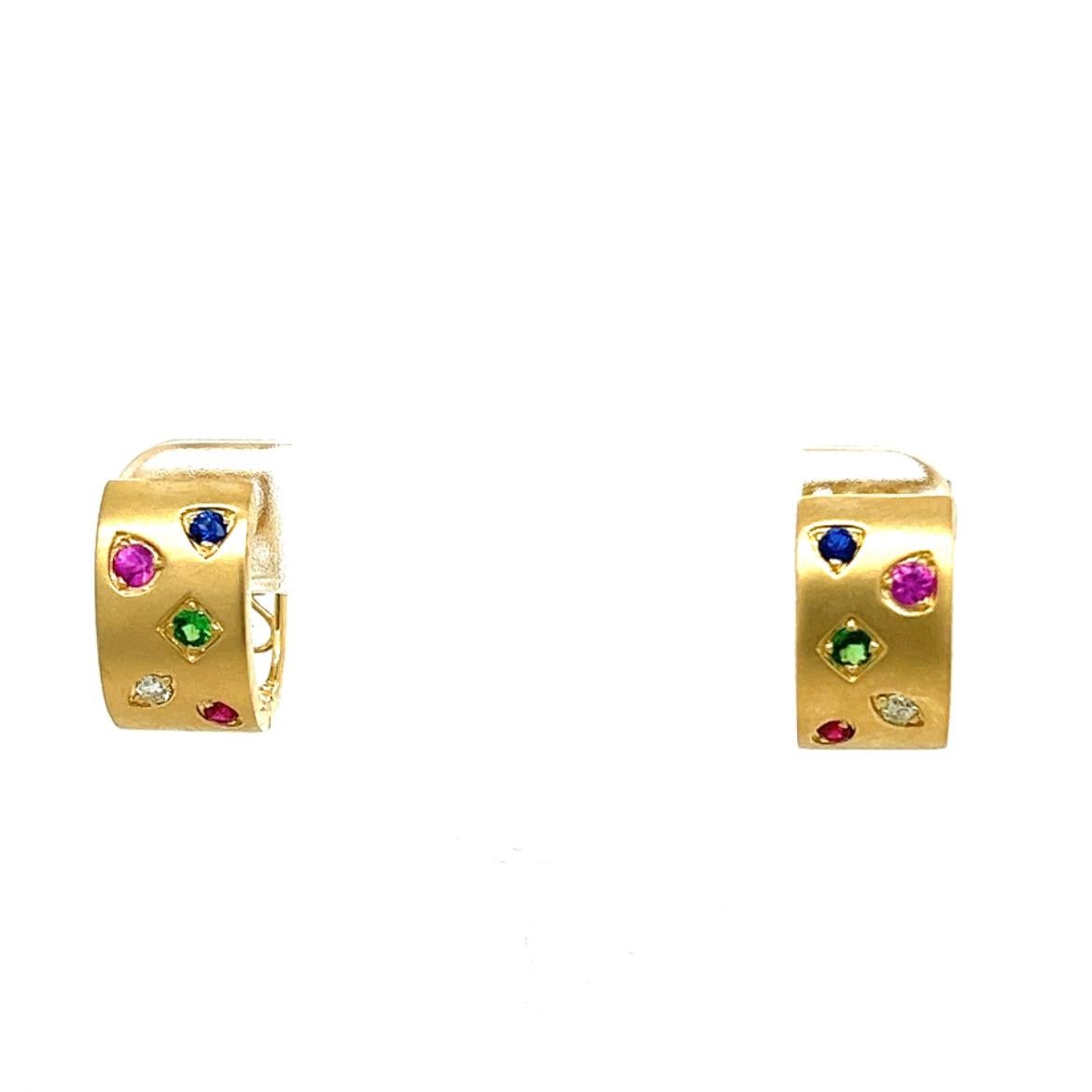 18K Yellow Gold Earrings with Multi-Color Gemstones and Diamonds
2 Blue Sapphires - 0.08 CT
2 Diamonds - 0.05 CT
2 Green Garnets - 0.10 CT
2 Pink Sapphires - 0.11 CT
2 Rubies - 0.05 CT
18K Yellow Gold - 6.36 GM
The artisans and designers at Althoff