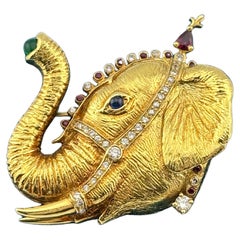 Brosche aus 18 Karat Gelbgold mit Elefanten, Diamant, Rubin, Saphir und Smaragd