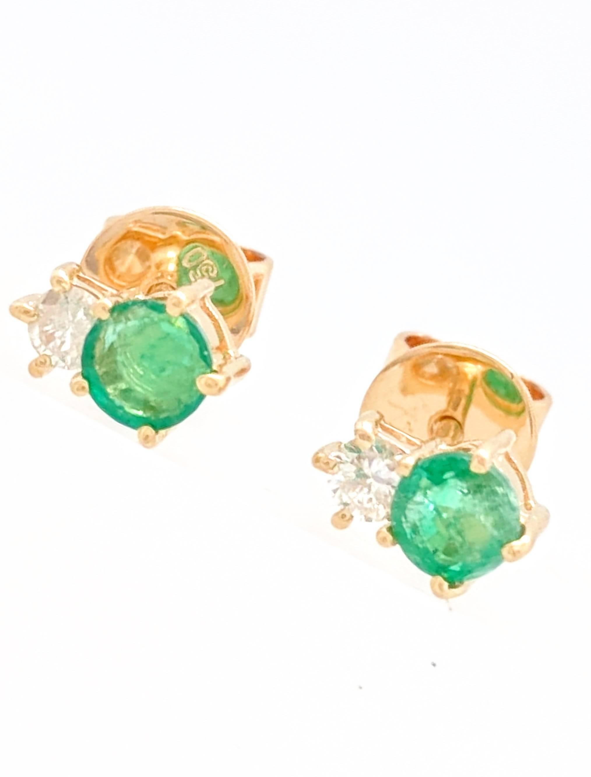 Ladies 18k Yellow Gold Emerald & Diamond Stud Earrings

You are viewing a beautiful pair of emerald & diamond stud earrings. These earrings are crafted from 18k yellow gold and weighs 1.5 grams. Each earring features (1) .20ct natural round emerald