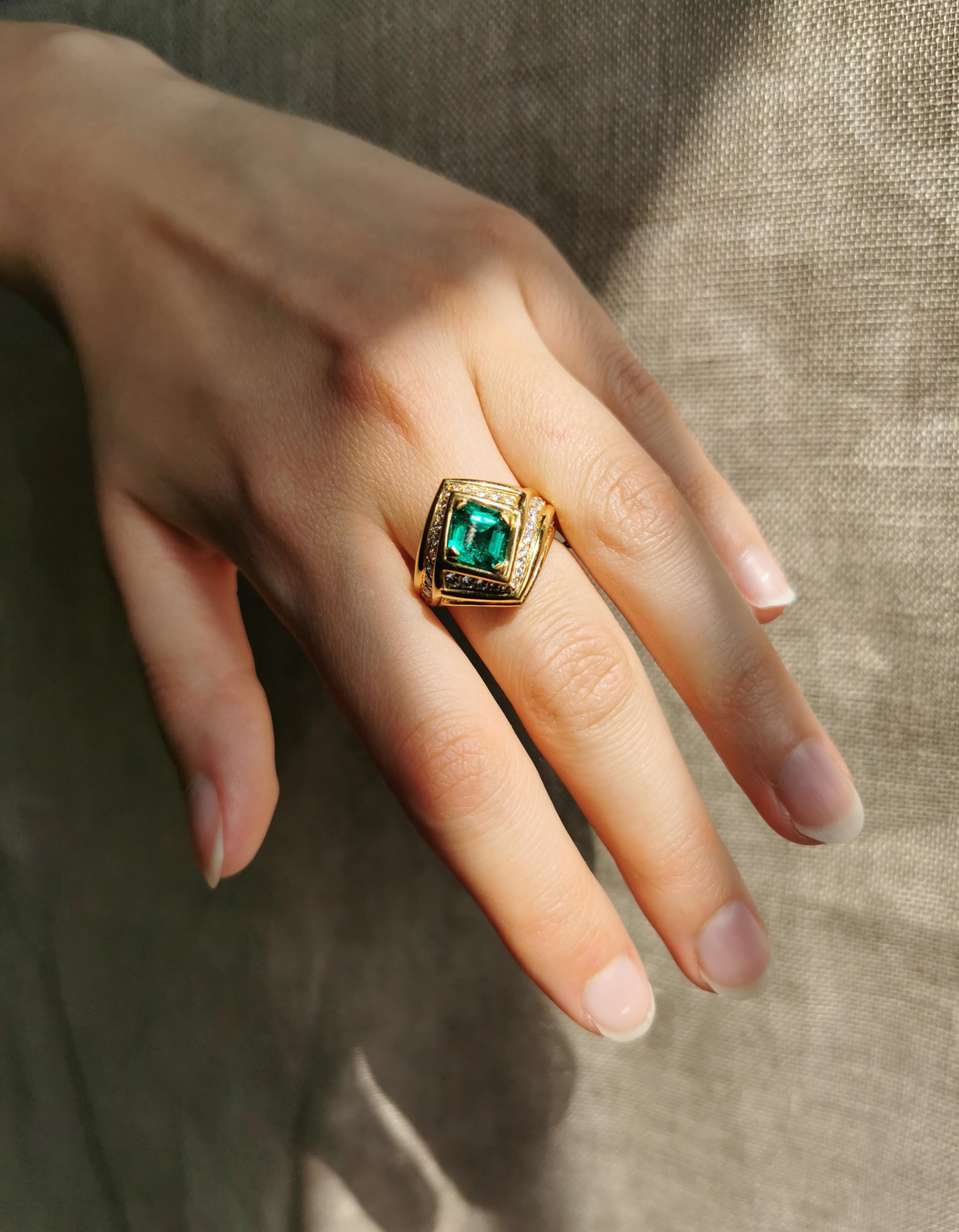 That 18K yellow gold ring set with a handsome emerald, emerald cut,  with a vivid intense green colour and with white diamonds.
Circa 1980, created by Marion Jeantet
Emerald weight: 1.23ct
diamonds weight: 1.50ct
This ring is a size 6 but can be