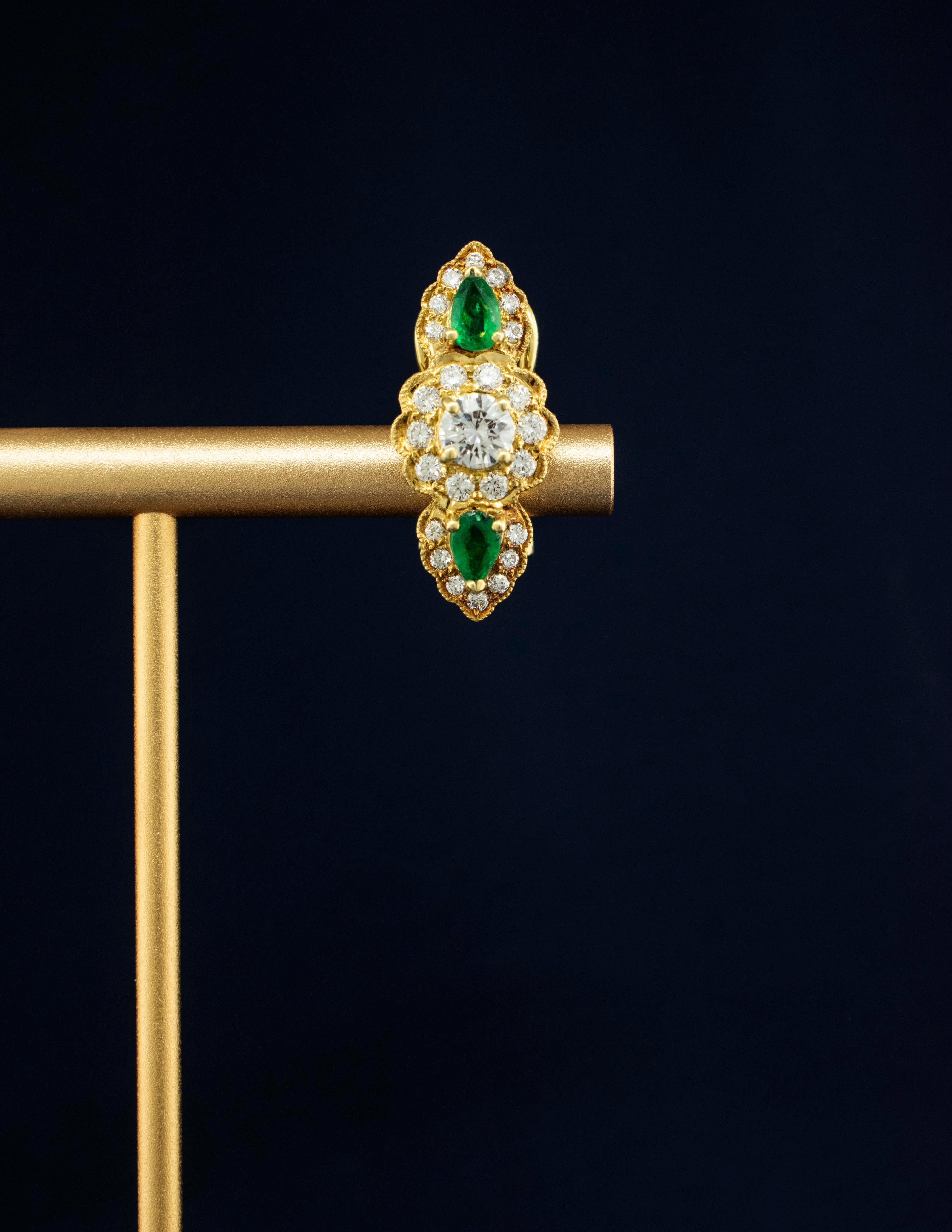 18k Yellow Gold Estate Emerald and Diamond Earrings
These fabulous earrings have approximately 1.50 carats of fine Diamonds grading F-G color, VS clarity. The pear shape Emeralds are bright, brilliant true emerald green.
The four Emeralds weigh