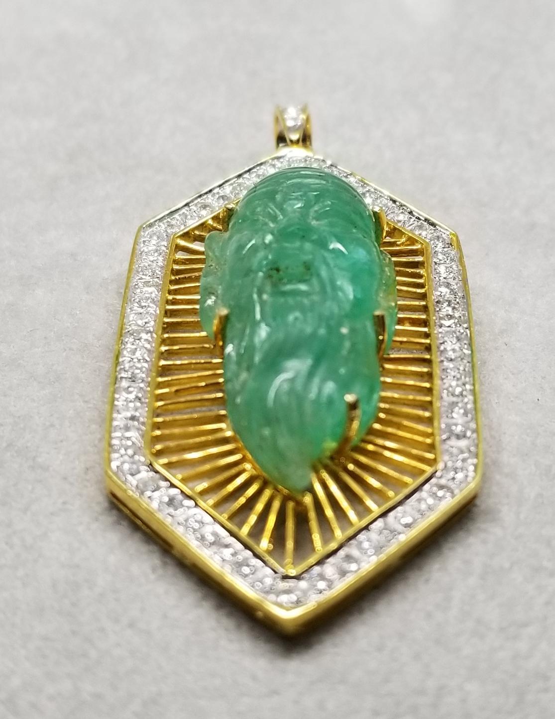 This piece of fine jewelry was designed and hand crafted by “Moshi” of New York, it was found in a vault from an estate sale and was never used.  18k yellow gold emerald and diamond pendant containing 1 hand carved emerald of an old bearded man