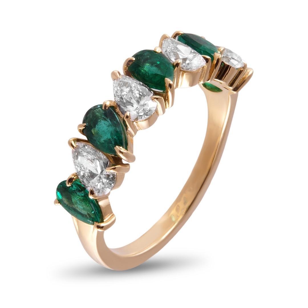 When considering different types of ring designs with colorful accents, there are a few that stand out; one of the most beautiful combinations is emeralds paired with diamonds. This exquisite and modern two tone gemstone ring showcases five 0.95