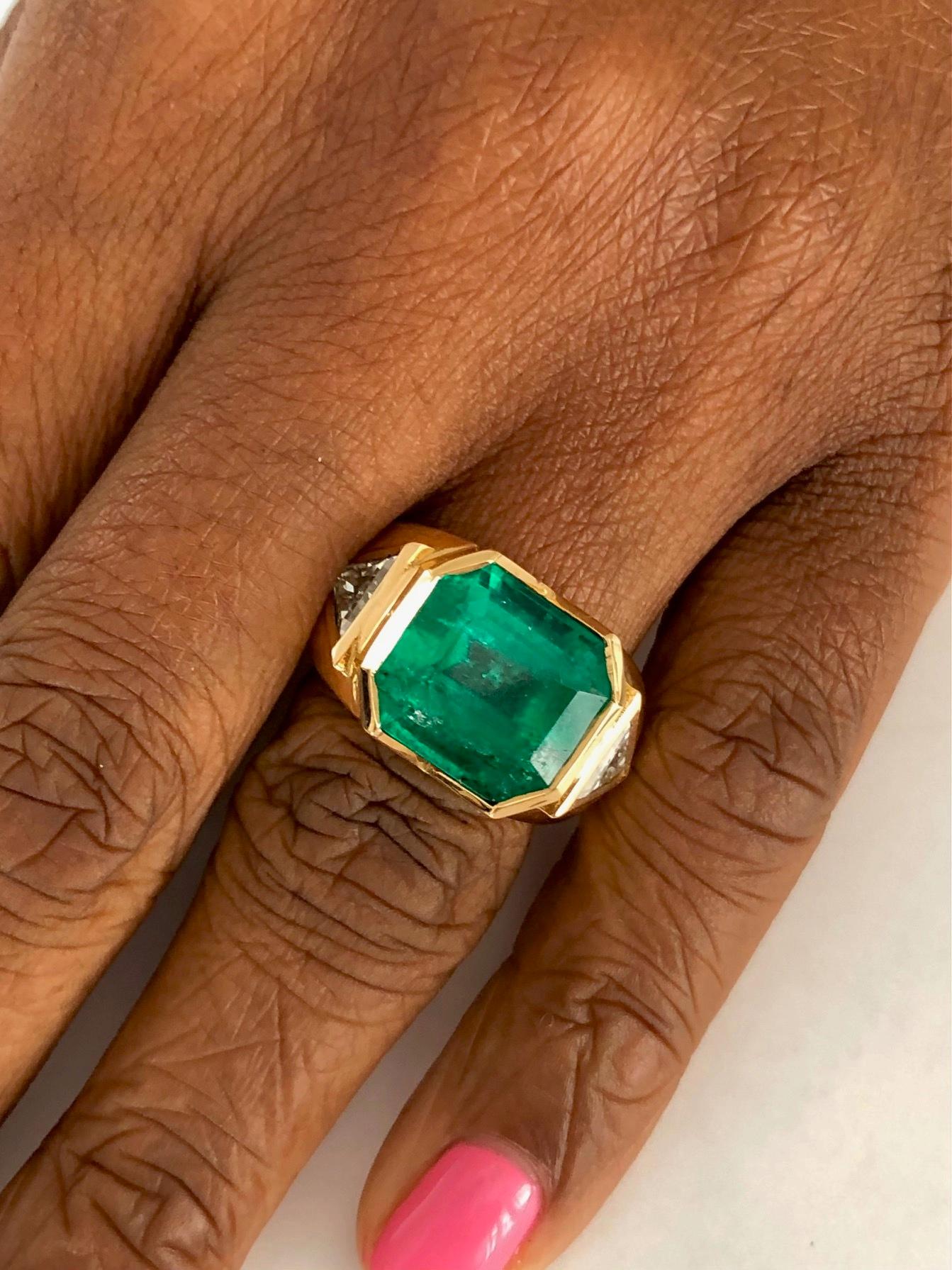 This one of a kind, handmade 18K Yellow Gold ring, set with a Colombian Emerald 8.41 carats and two Diamonds 0.93 carats.
Styled to look different than the cookie cutter look....

We design and manufacture our jewelry in our workshop, located in New