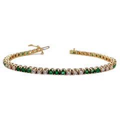 Tennisarmband aus 18 Karat Gelbgold mit Smaragd und Diamant