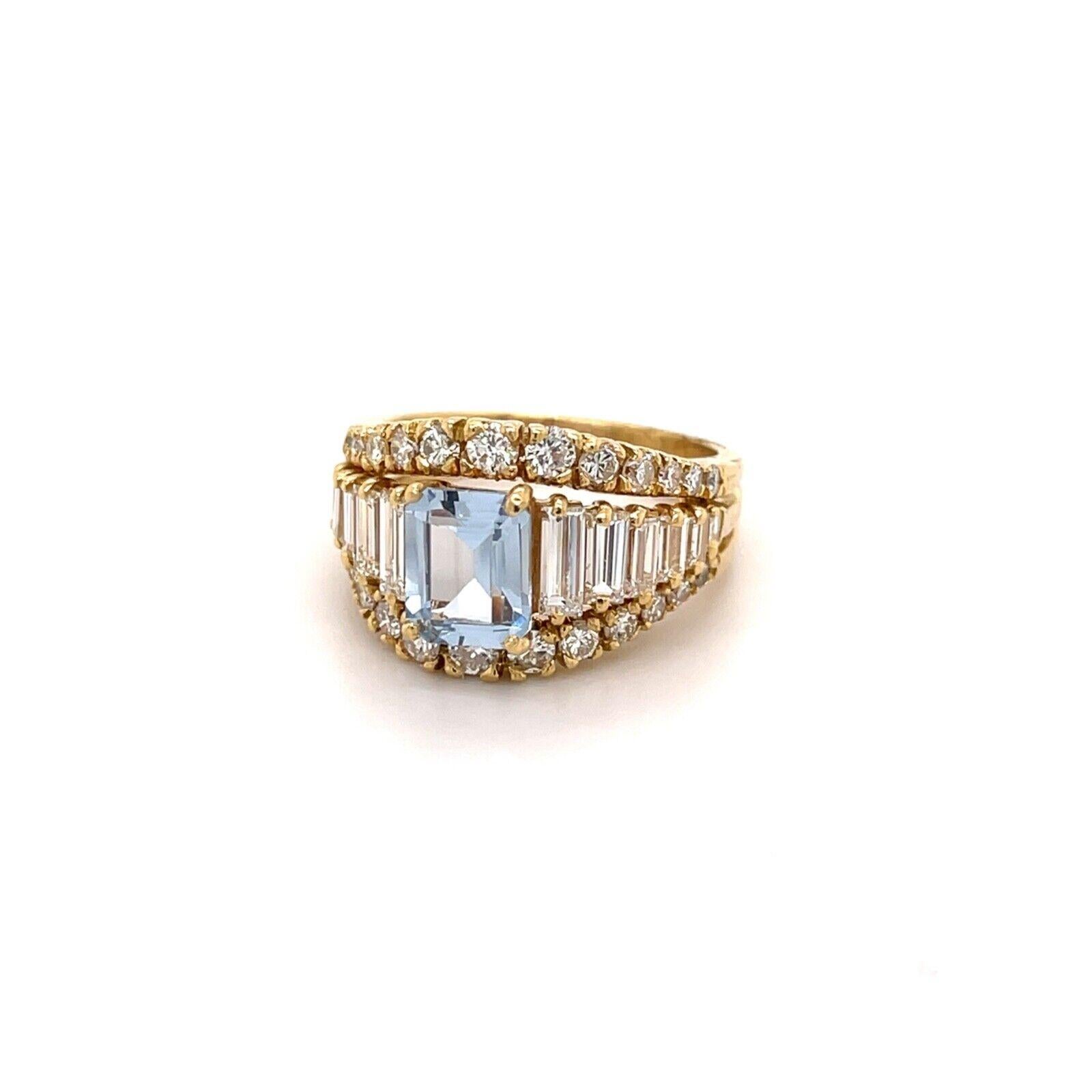 18k Yellow Gold Emerald Cut Blue Aquamarine With Baguette And Round Diamond Ring
Size 8
8.9 Grams
1 Center Emerald Cut Aquamarine  7.75x6.25mm
Side Baguette And Round Cut Diamonds 1 Carats Total Weight
Color: G/H Clarity: VS2-Si1
This is a very cute
