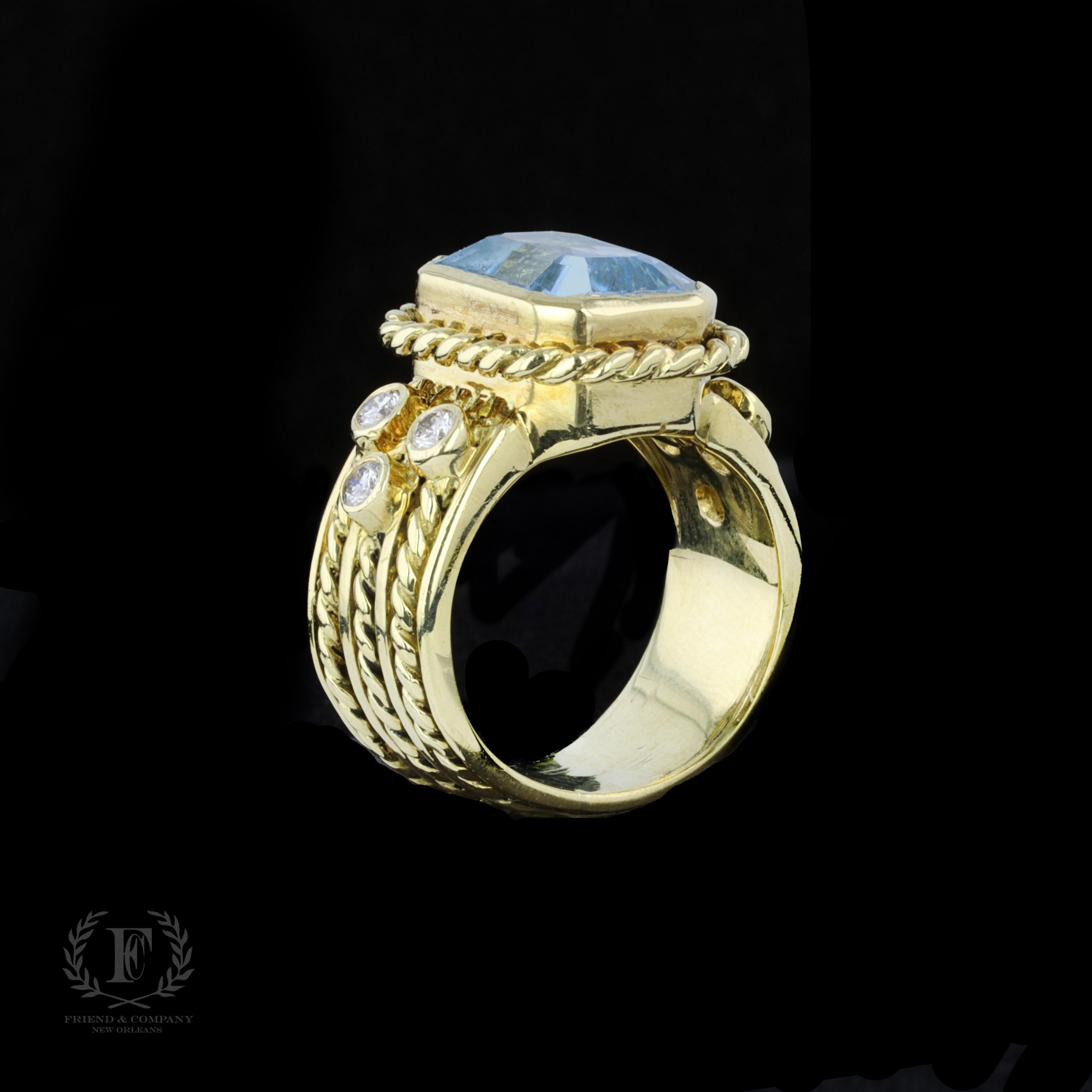 Rétro Bague en or jaune 18 carats avec topaze bleue taille émeraude et diamants en vente