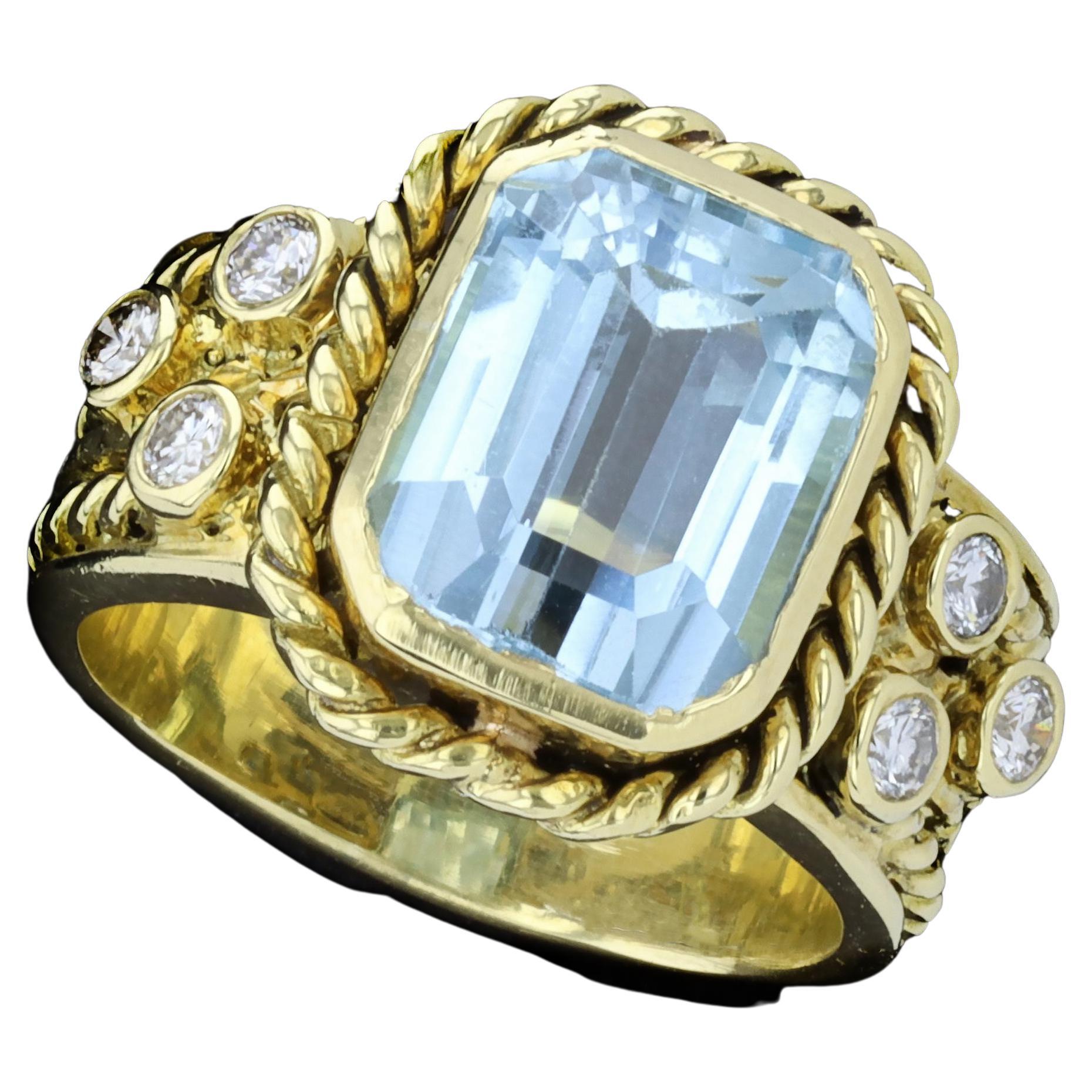 18 Karat Gelbgold Ring mit blauem Topas im Smaragdschliff und Diamanten