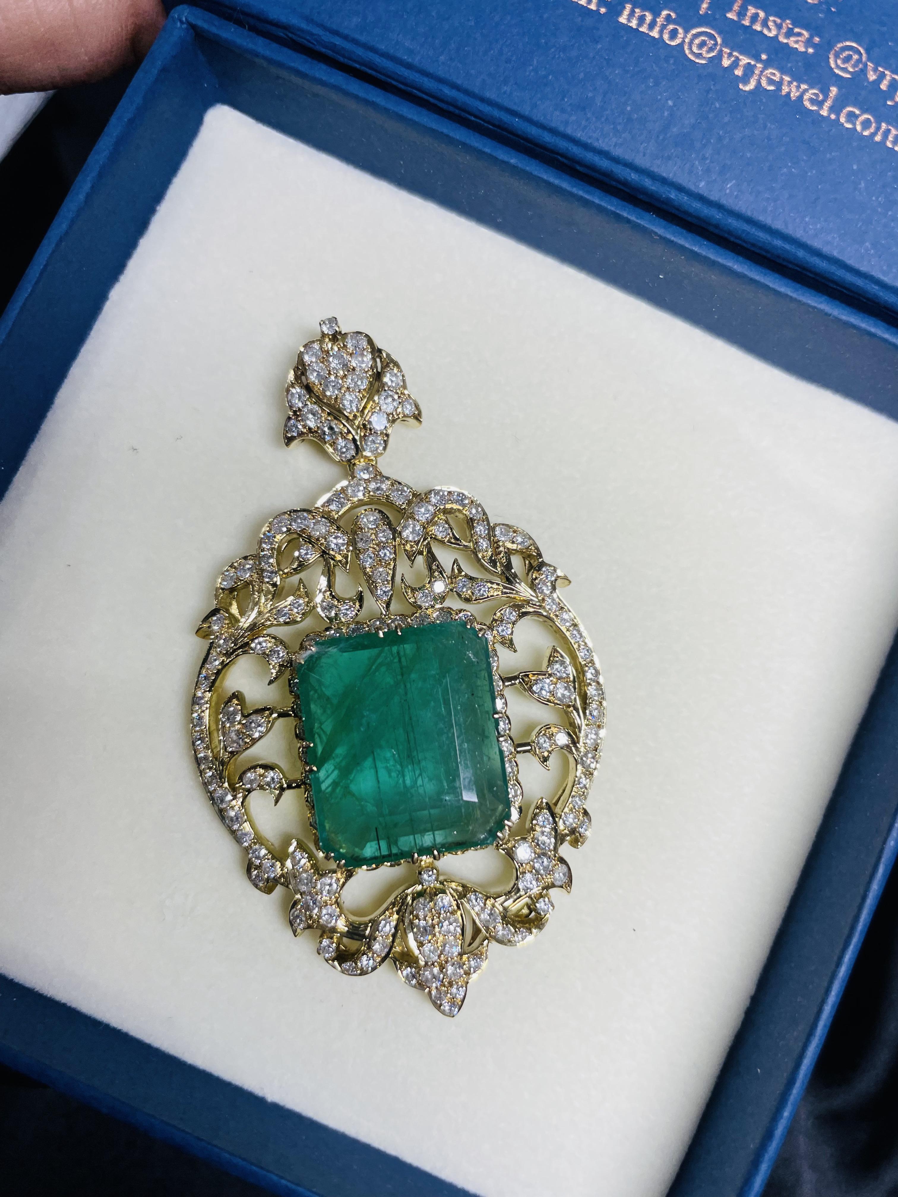 Emerald pendant in 18K Gold. It has a octagon cut emerald studded with diamonds that completes your look with a decent touch. Pendants are used to wear or gifted to represent love and promises. It's an attractive jewelry piece that goes with every