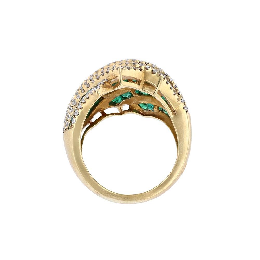 This ring is made in 18K yellow gold and features 72 round-cut emeralds weighing 2.92 carats. It also features 150 round cut diamonds weighing 1.15 carats. With a clarity grade of (SI2).