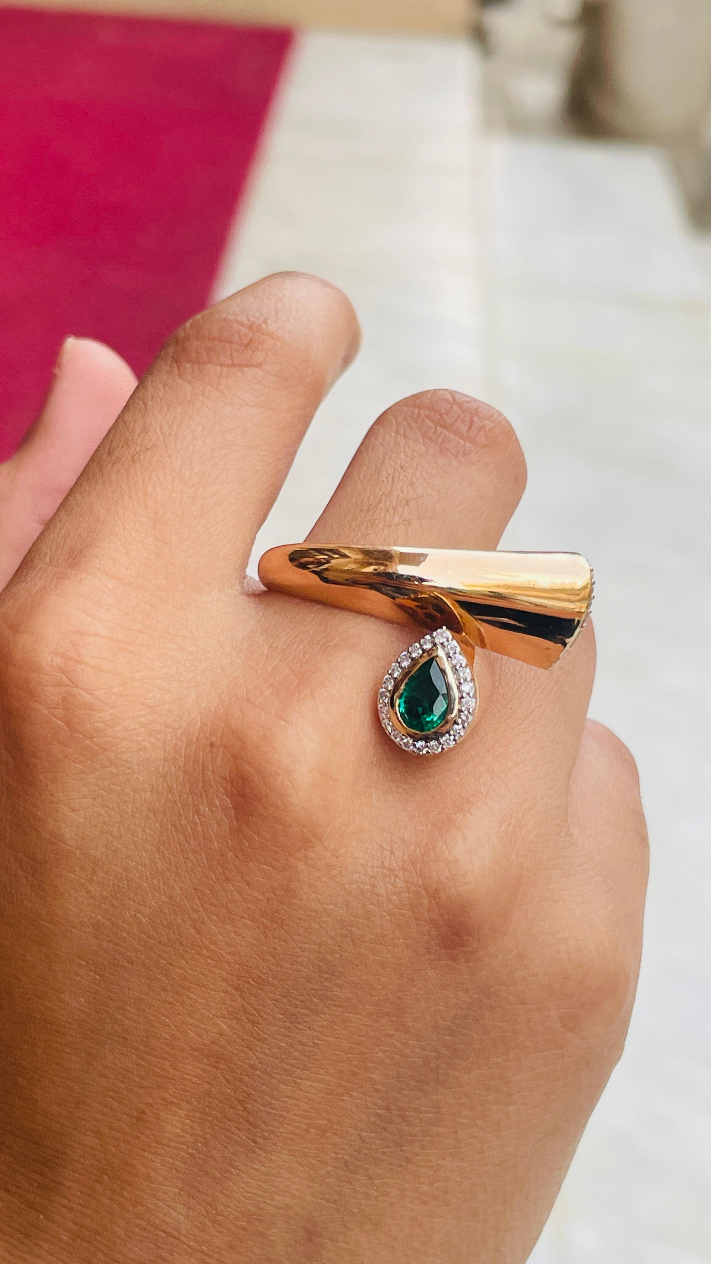 For Sale:  Unique 18k Solid Yellow Gold Emerald and Diamond Bypass Ring 7