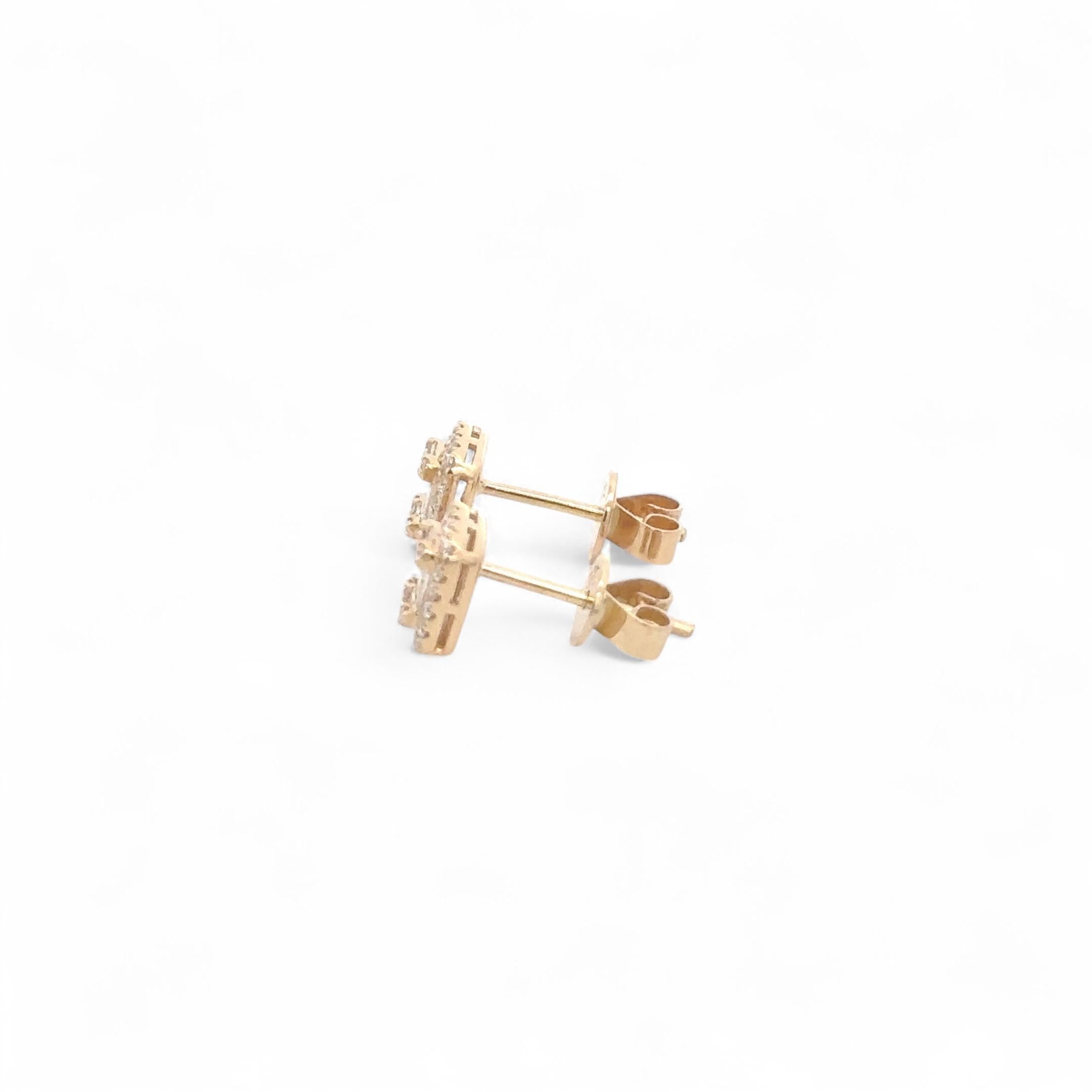 These beautiful 18K yellow gold studs are a masterful blend of classic elegance and modern design. At the heart of each earring lies an emerald-cut diamond, renowned for its elongated shape and sophisticated step cuts, reflecting light with