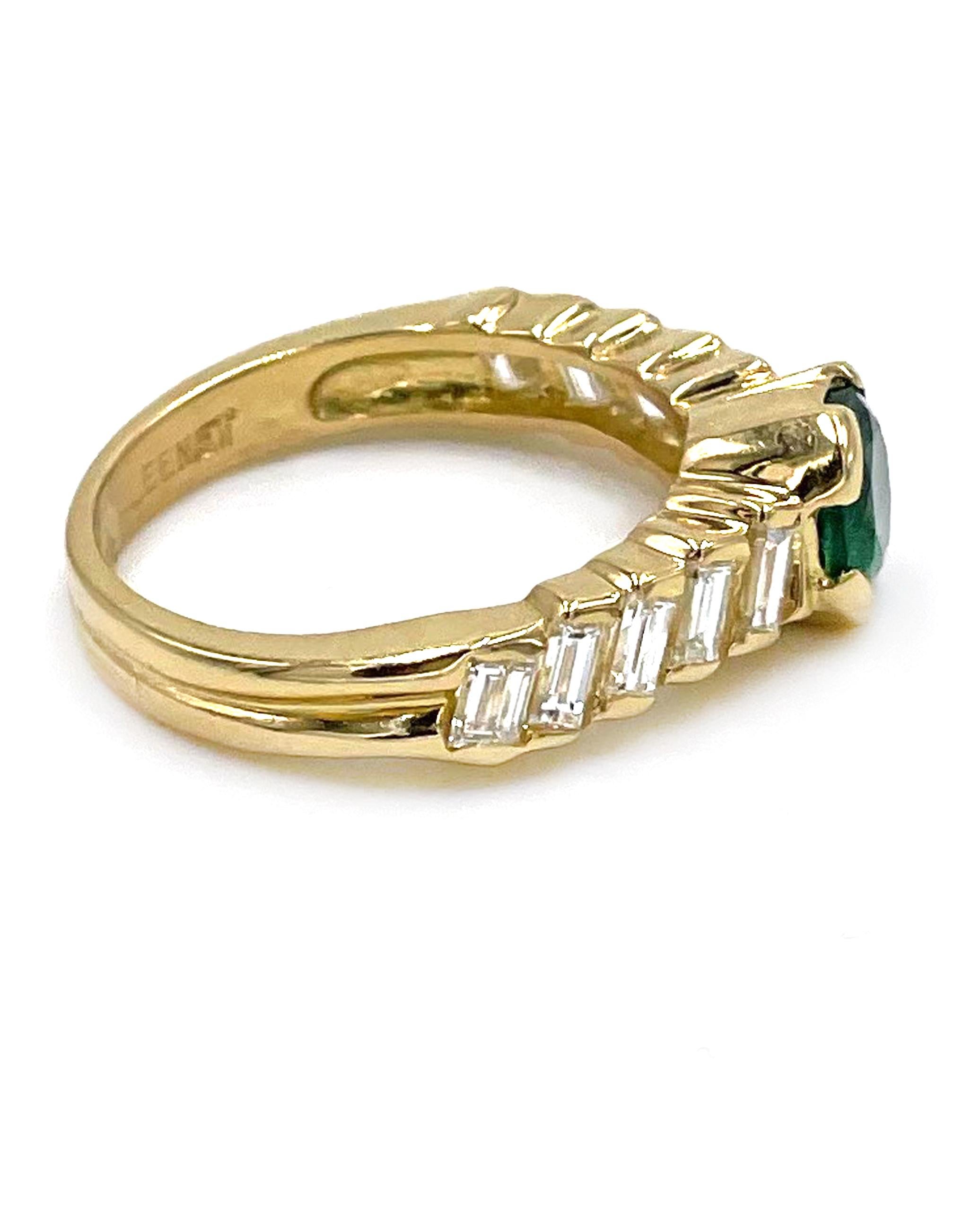 Preowned 18K yellow gold ring with 10 straight baguette diamonds weighing 1.20 carats total: G color, VS clarity. Center is set with one round faceted emerald weighing 1.01 carats.

*Finger size 6
