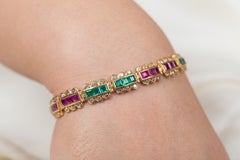 Armband aus 18 Karat Gelbgold mit Smaragd, Rubin und Diamanten