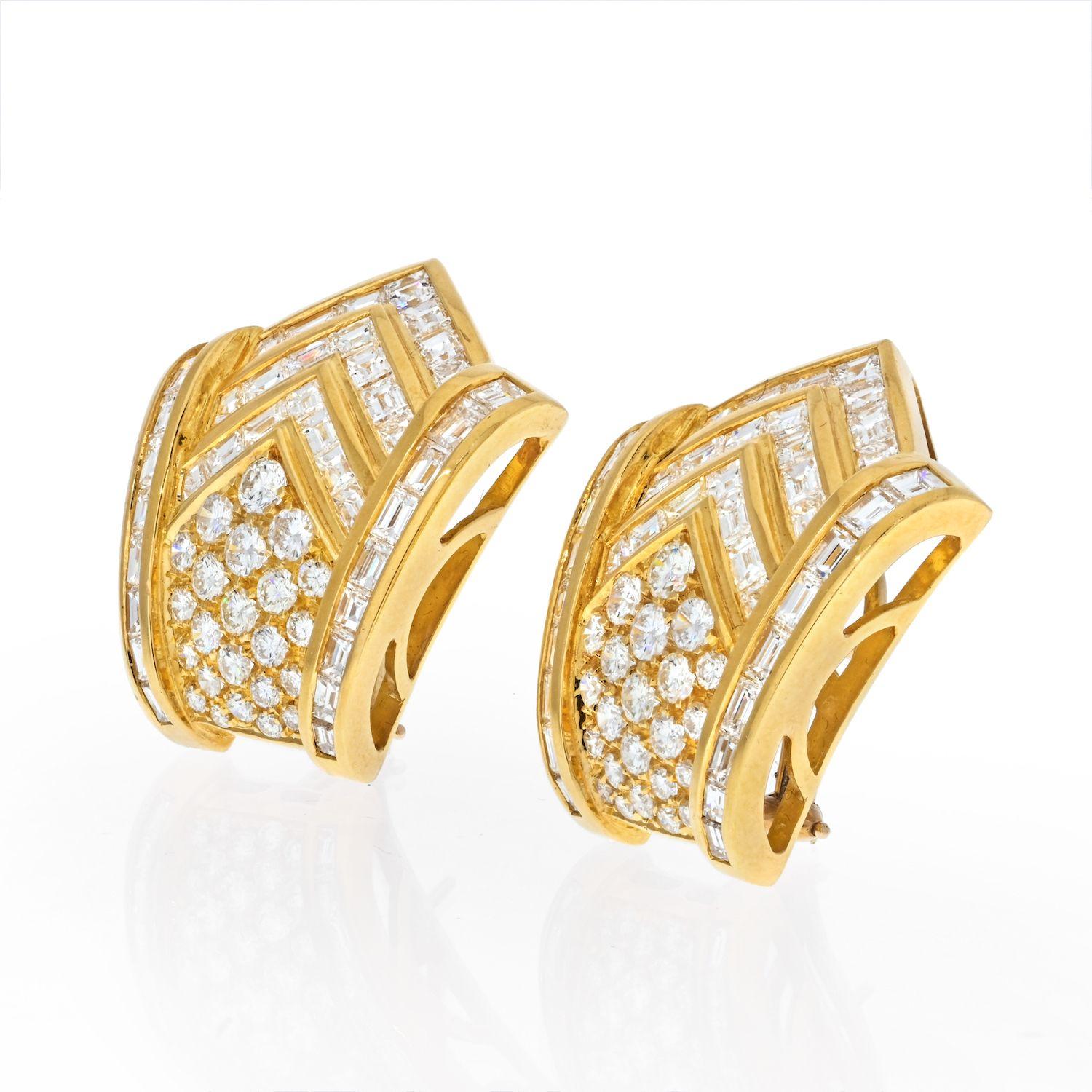 Attractive estate baguette and round cut diamond earrings. Each consisting of channel set lines of baguette diamonds and top quality prong set round diamonds. The latter are prong set so they are as snuggly clustered as possible. A very attractive