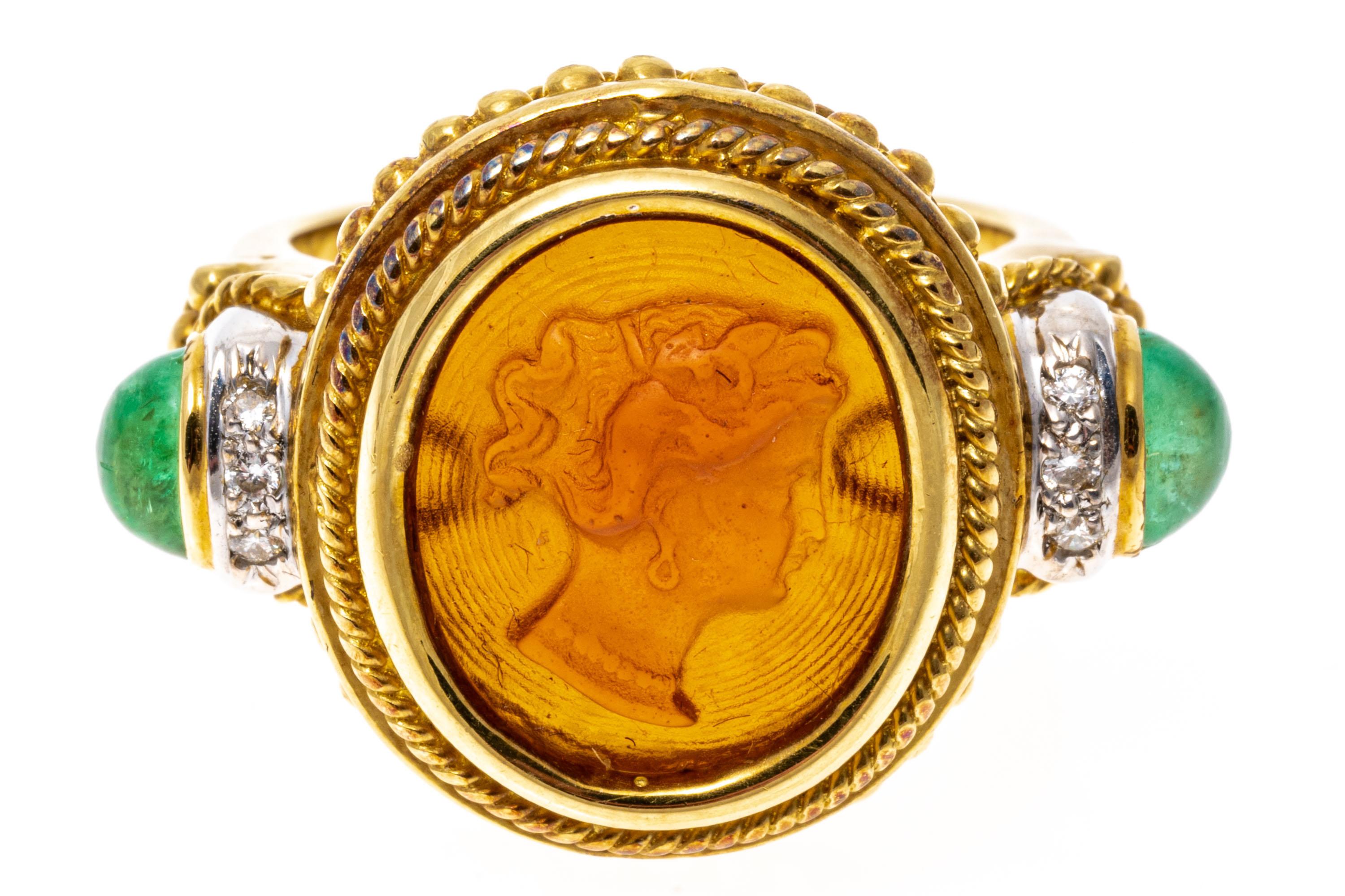 18k yellow gold ring. This beautiful contemporary cameo ring has an amber colored sea glass handsome profile bust, facing to the right, and set off with a grooved disc pattern in the background; bezel set, with a fine twisted wire frame and an