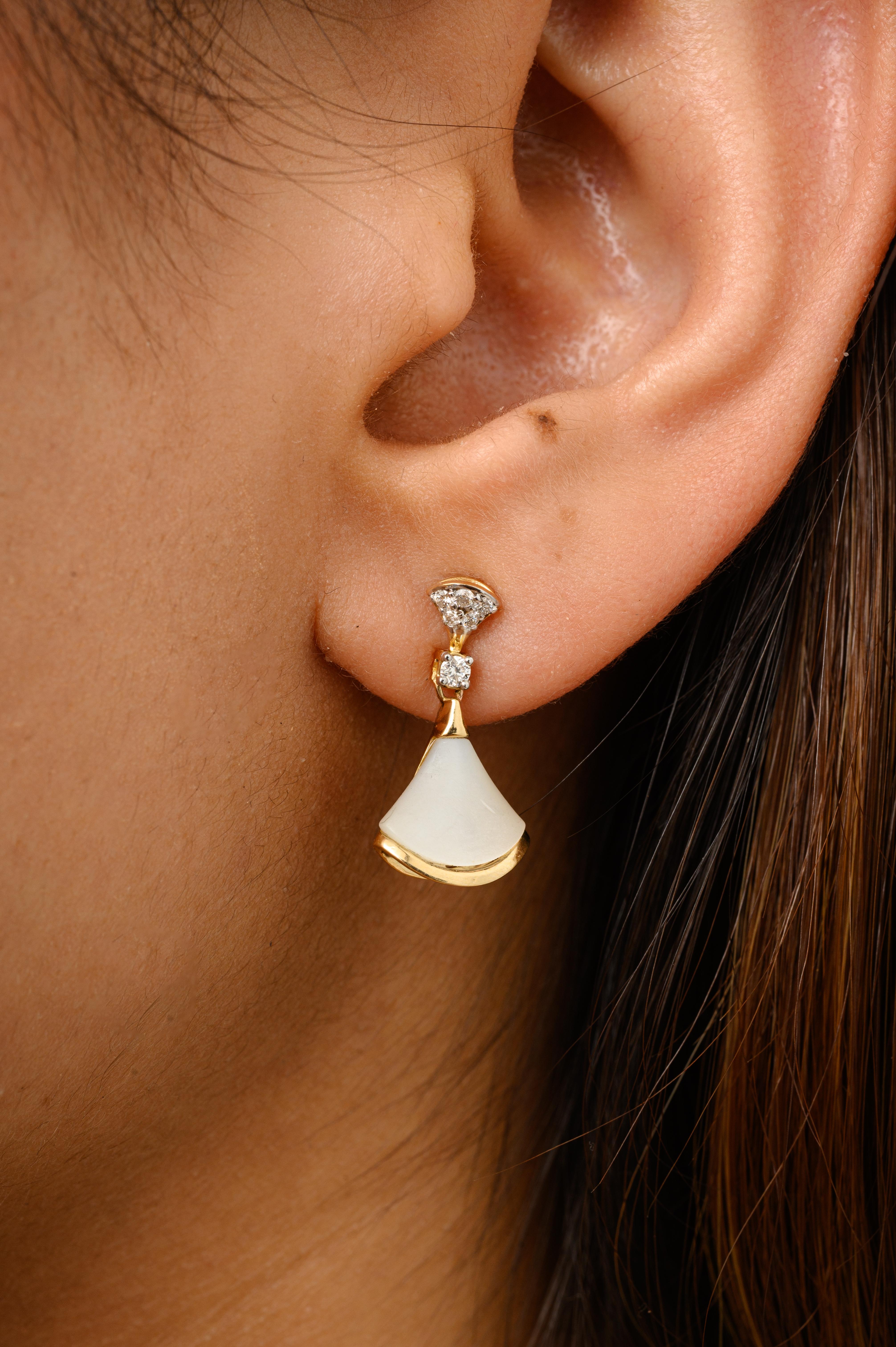 Fan Shape Mother of Pearl and Diamond Dangle Earrings in 18K Gold to make a statement with your look. You shall need dangle drop earrings to make a statement with your look. These earrings create a sparkling, luxurious look featuring fan shape
