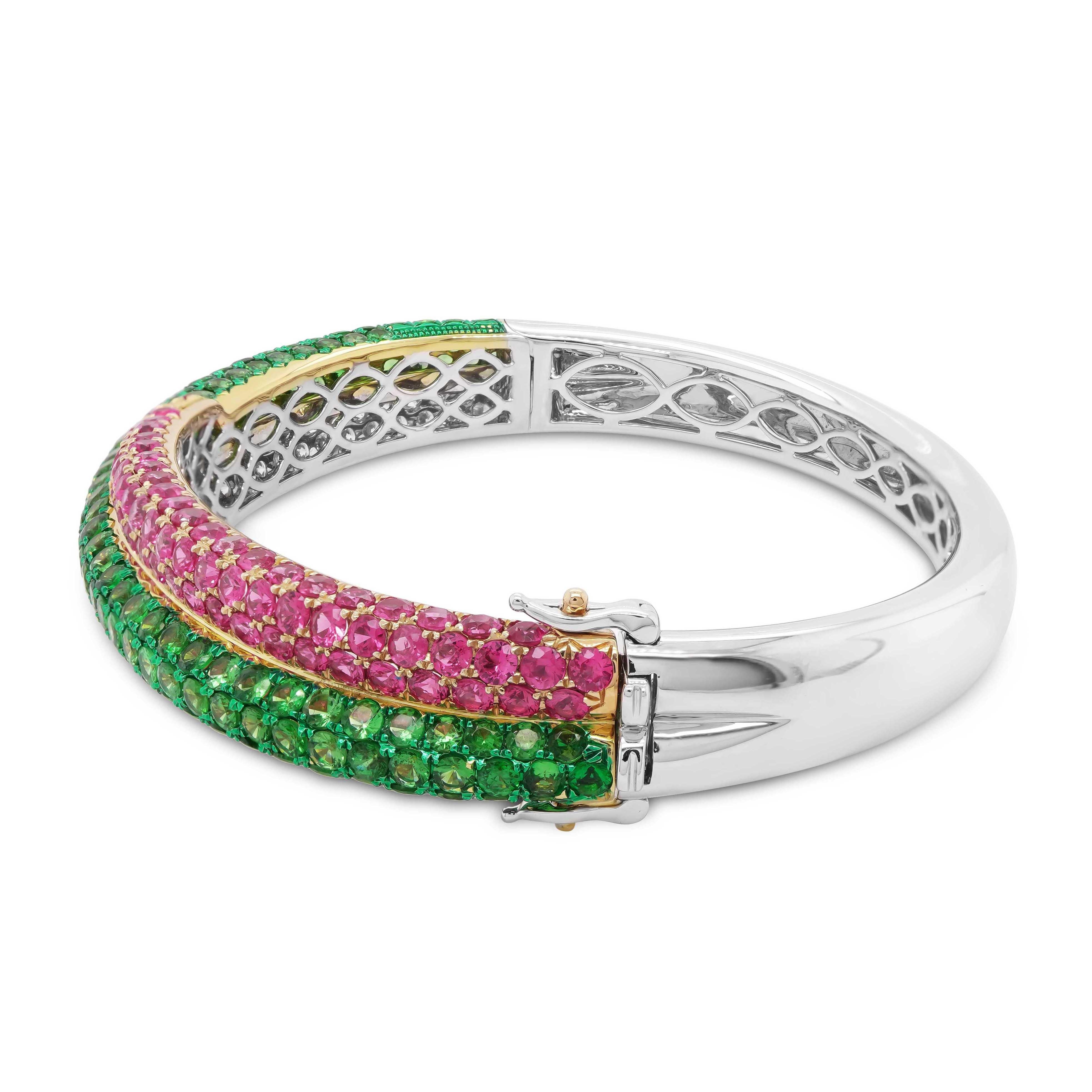  A green and pink bangle set with two bands, one comprising of Tsavorites handpicked from East Africa and the other with pink sapphires from Sri Lanka. A total of 6.17 carat of Tsavorite, 2.95 carat of pink sapphire and 2.36 carat of white diamond