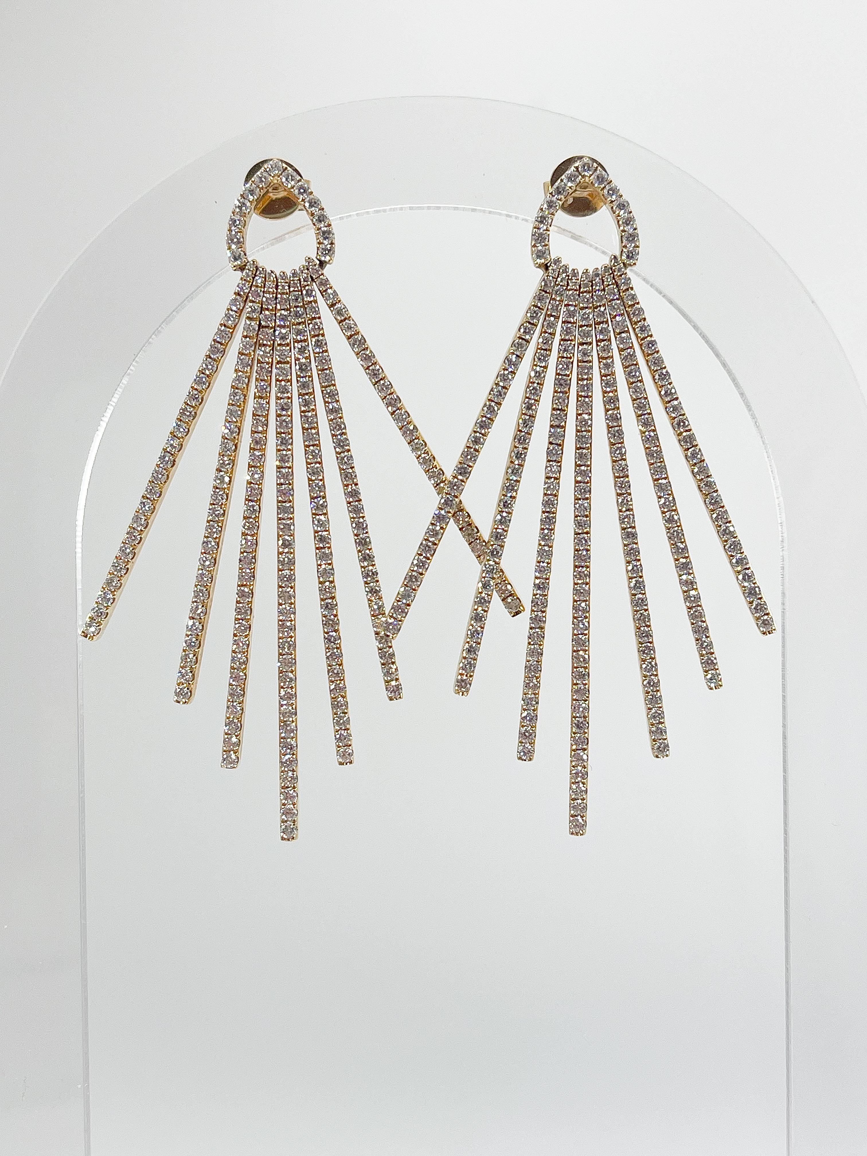 18k yellow gold fancy 4.18 CTW diamond dangle earrings. These earrings have 7 rows of diamonds that measures 2.3 inches from top to bottom and they have a total weight of 17 grams.